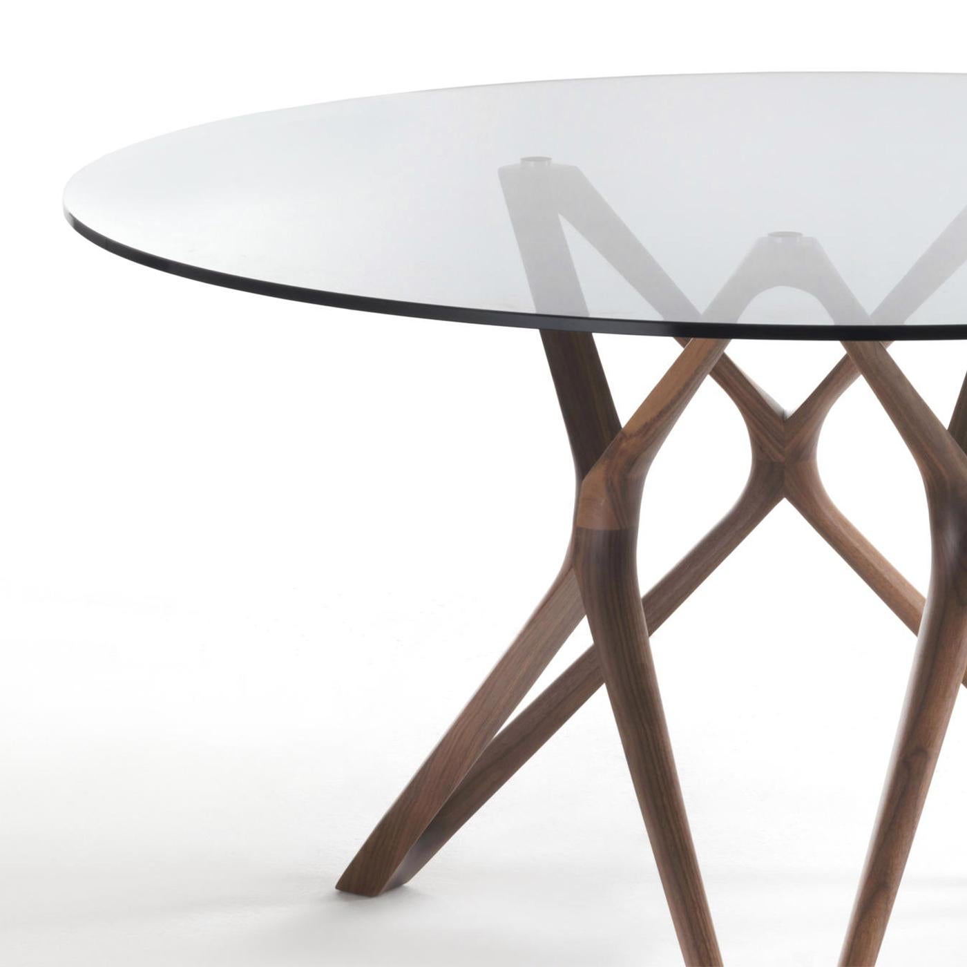 Table Giulia round with base in solid walnut wood,
handcrafted wood. With tempered clear glass top
(12mm thickness).
Available on request in:
Diameter 130cm x height 75cm, price: 7600,00€.
Diameter 140cm x height 75cm, price: 7900,00€.
Diameter
