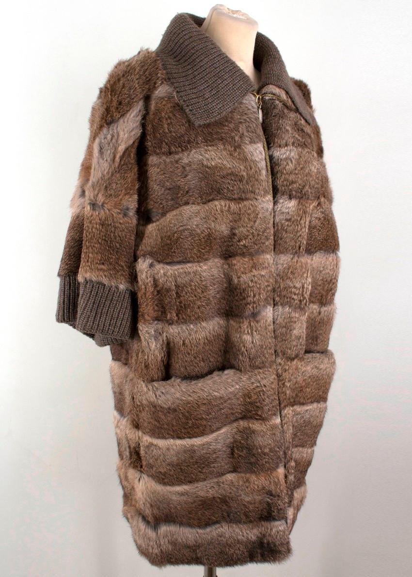 Giuliana Teso Rabbit Fur Jacket

-Fur jacket with 3/4 length sleeves
-Ribbed collar and cuffs 
-Two front pockets
-Gold-toned zip with two zip pulls

Please note, these items are pre-owned and may show signs of being stored even when unworn and