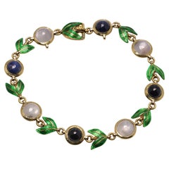 Giuliano 18kt gold bracelet with enamel, cabochon sapphires and moonstones