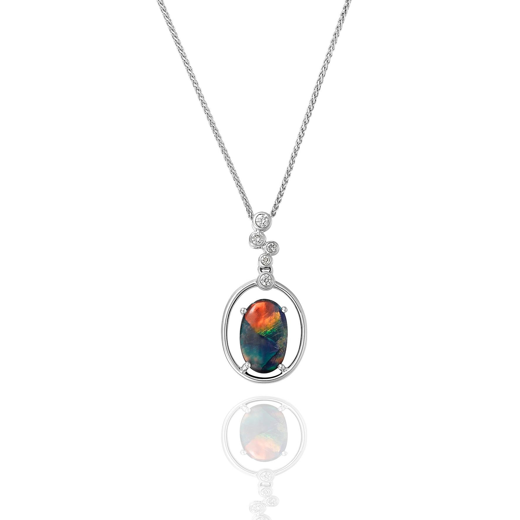Giulians handcrafted 18 karat white gold Australian Black Opal and Diamond Pendant Necklace.  This pendant features a 1.78ct natural, solid black opal from Lightning Ridge, NSW.  The opal is set in 4 prongs within a  18 karat white gold framework.