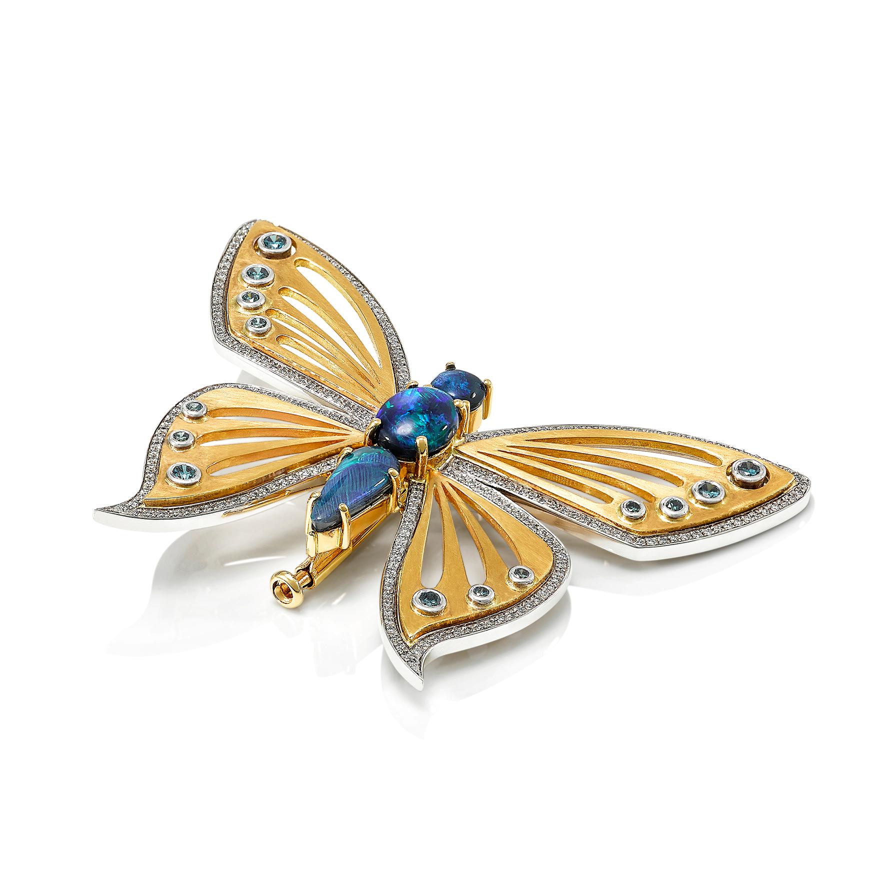 Giulians 18 karat handcrafted Australian Black opal and diamond butterfly brooch.  This brooch features 3 natural solid black opals from Lightning Ridge NSW, with a total weight of 2.16 carats, in prong settings.  The  wings of the butterfly have