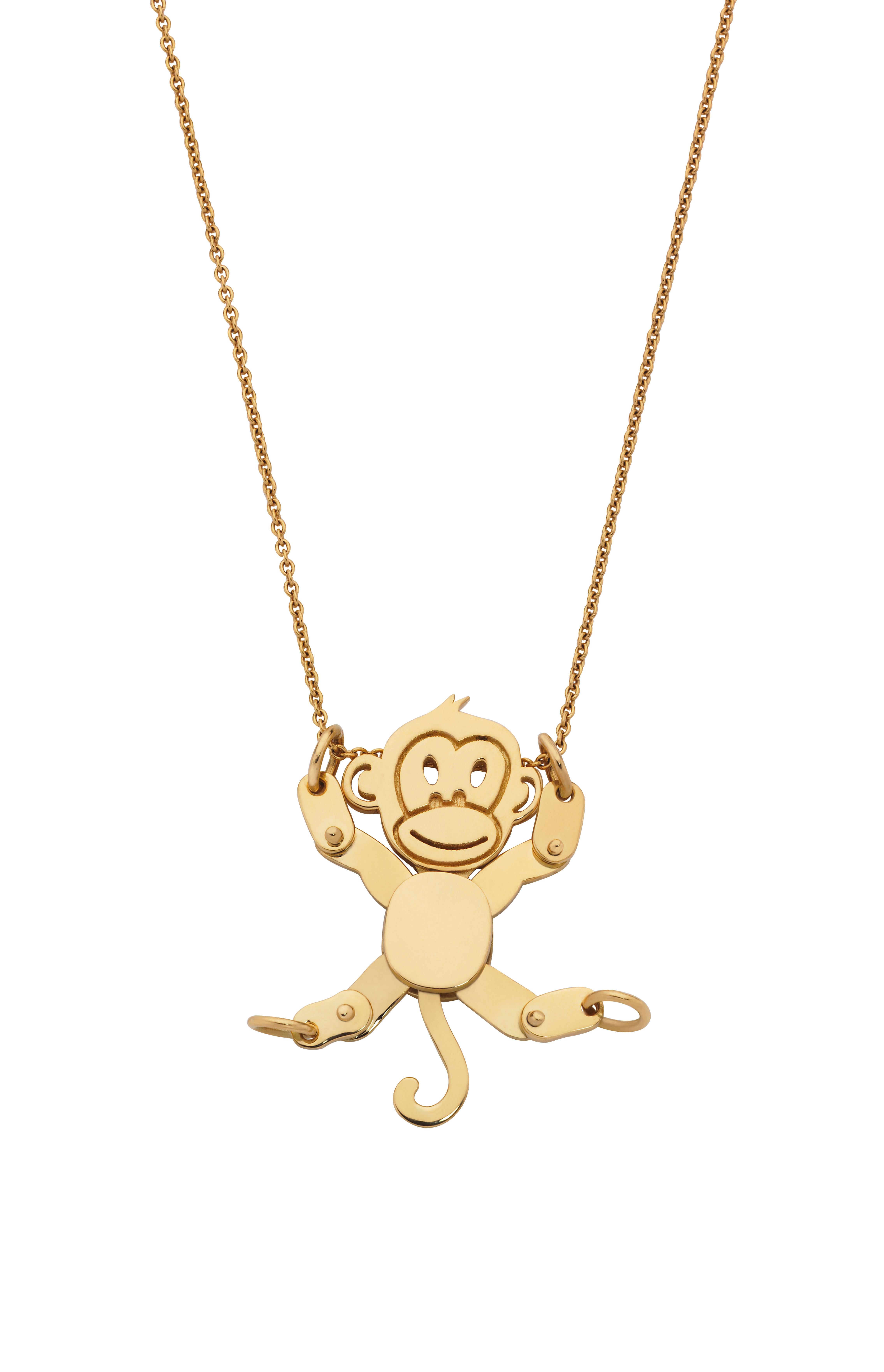 Giulians 18 karat yellow gold movable monkey pendant.  This playful pendant features a monkey with articulated arms and legs.  The chain can run through any of the loops in the hands or feet, allowing for the monkey to be worn in a myriad of poses. 