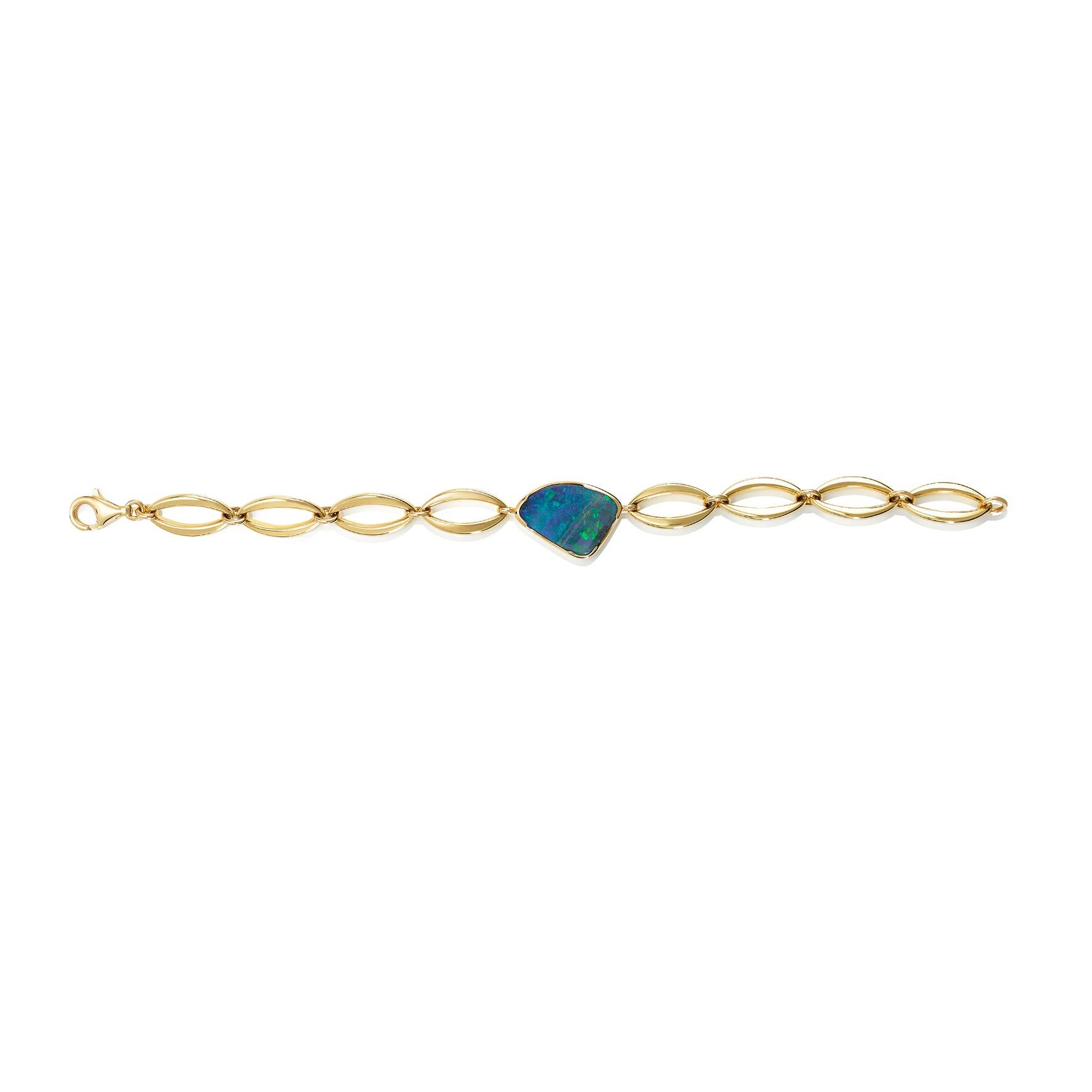 Giulians contemporary 18 karat yellow gold Australian Boulder Opal bracelet.  Showcasing a 7.90ct free-form natural solid opal from Queensland with bright blue and green play-of-color. The opal has been set in a fine 18ct yellow gold bezel, with