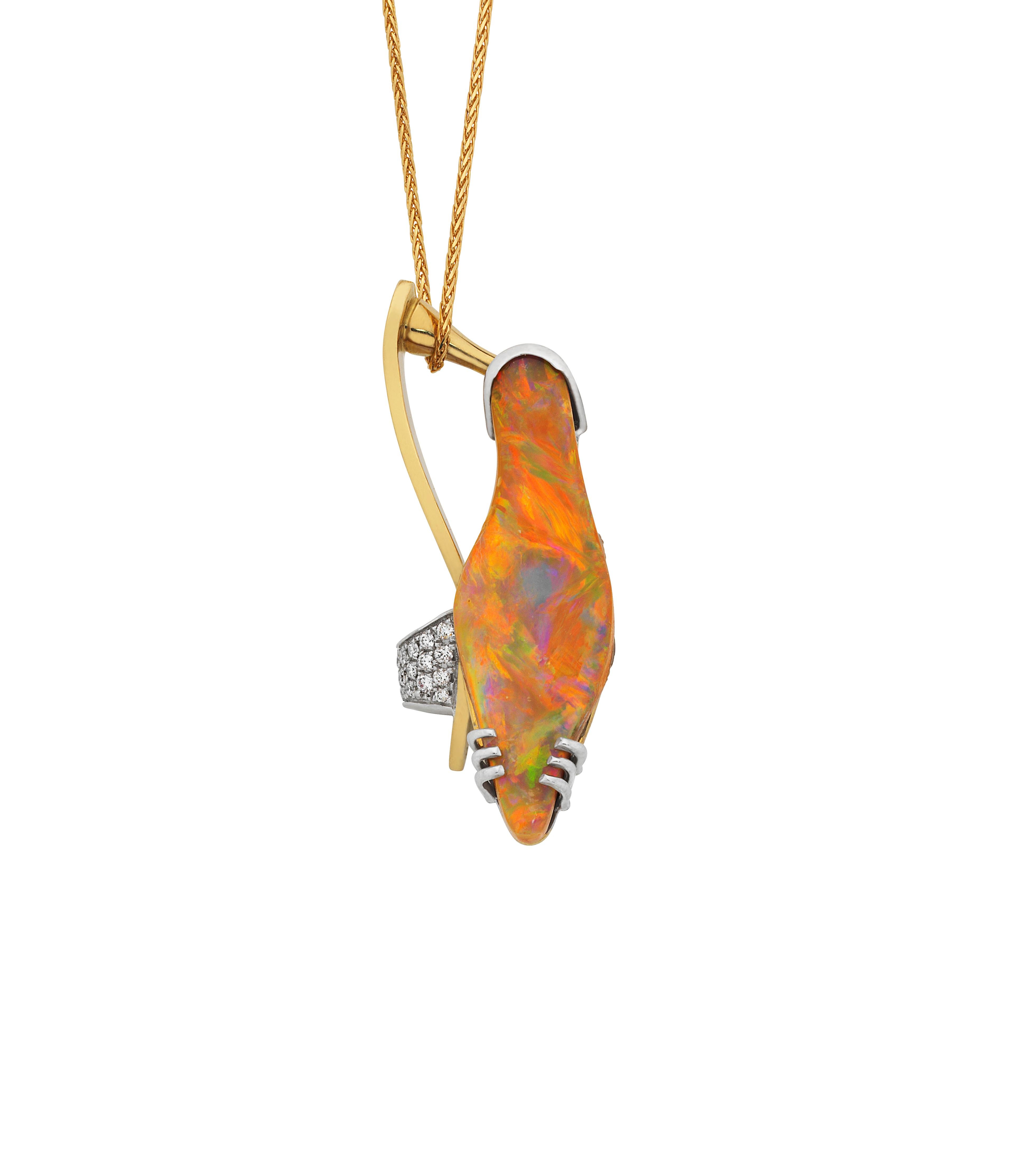 Giulians handmade 18 karat yellow and white gold 11.78ct Australian Boulder opal and Diamond pendant.  The pendant showcases a natural solid Australian Boulder opal, from Queensland, with a light colour and bright pastel fire.  The shape of the opal
