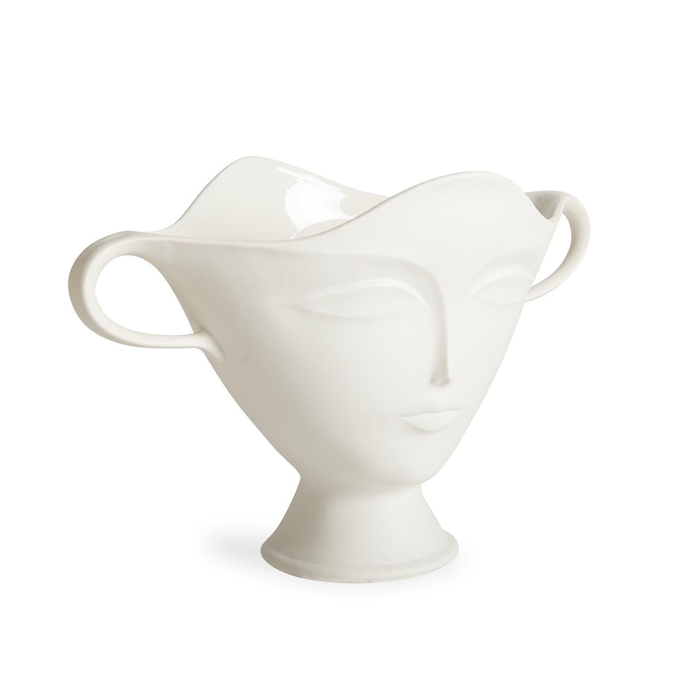 Divine detail. Take your tablescape from so-so to sublime. Made from white porcelain with a matte finish and clear interior glaze, our spin on this traditional, flower-friendly vessel features our muse Giuliette's ethereal face on both front and