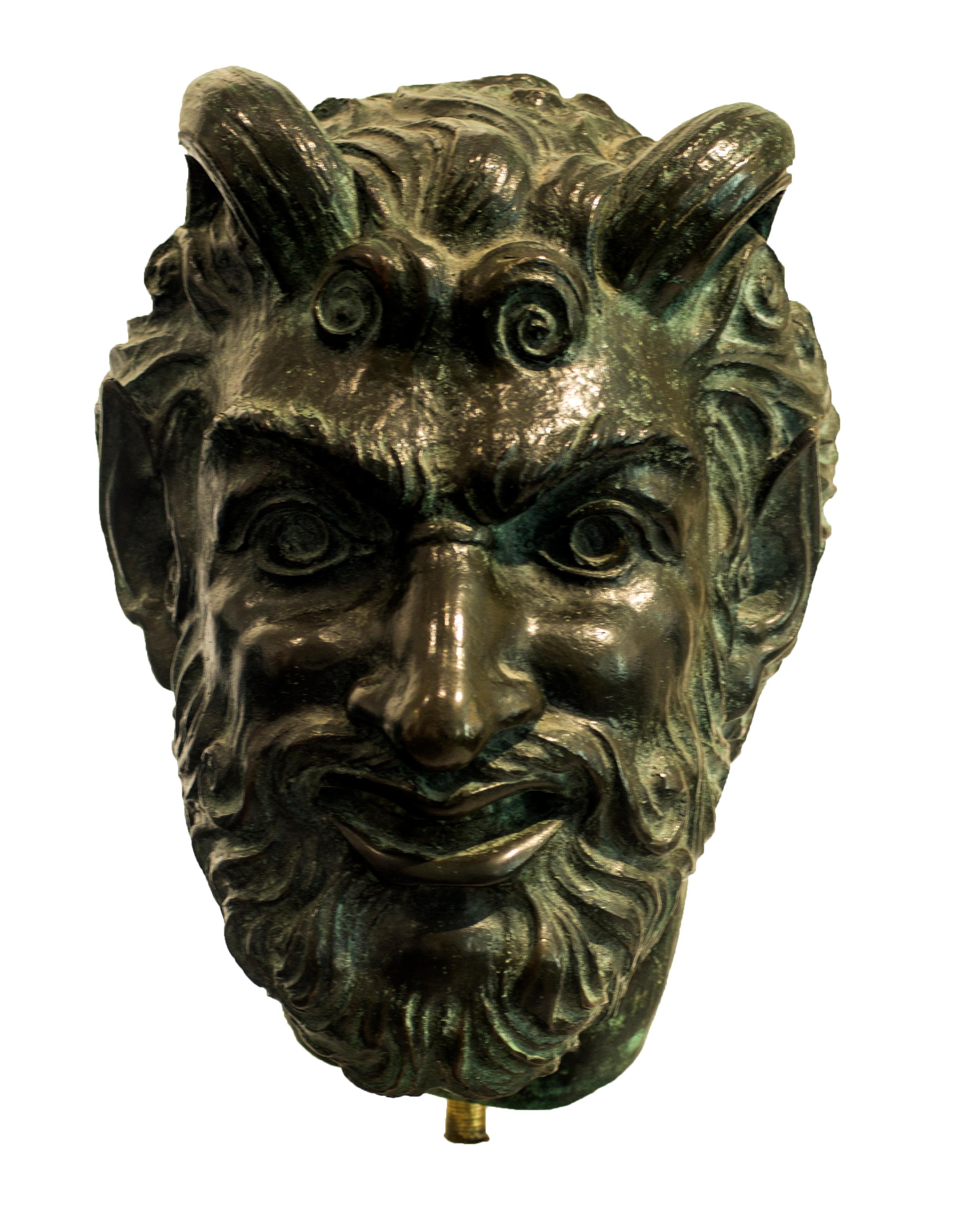 Bronze head sculpture realized by Giulio Aristide Sartorio, an Italian painter, sculptor and film director from Rome.

Having attended the Rome Institute of Fine Arts, Sartorio presented a Symbolist work at the 1883 International Exposition of Rome.