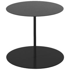 Table Gong de Giulio Cappellini en métal anthracite découpé au laser et plateau mat