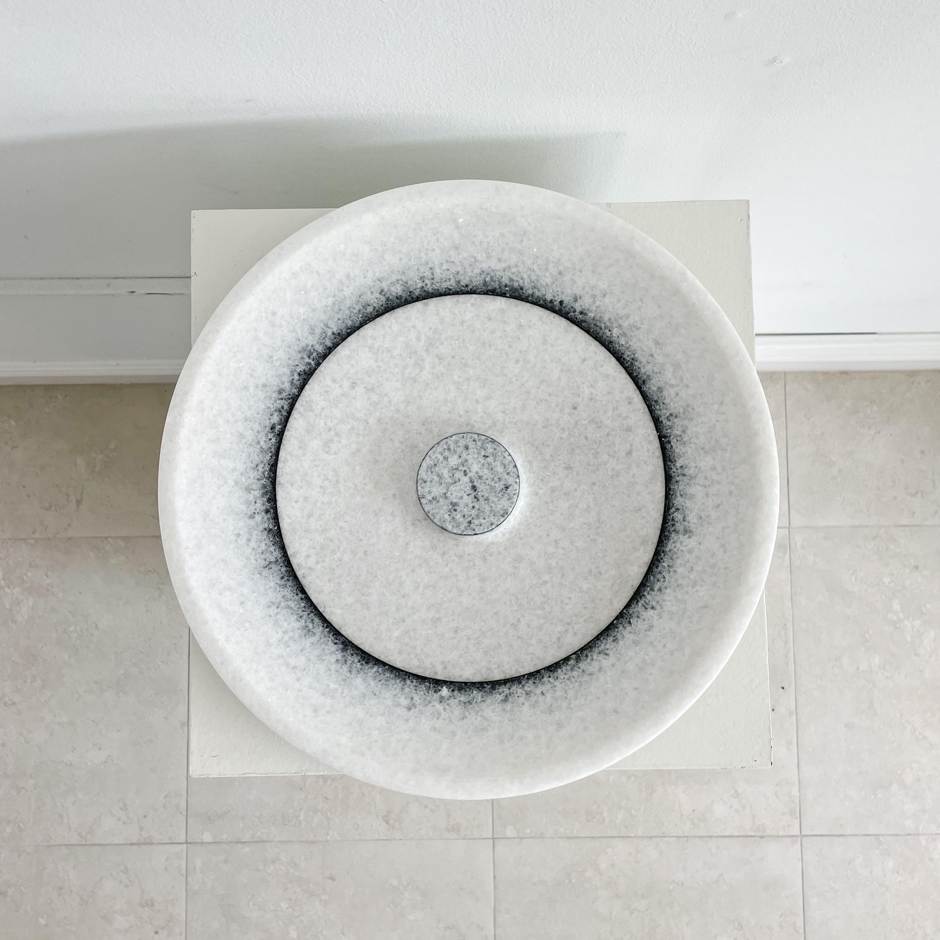 Modern white quartzite marble with black circular details centerpiece low bowl or charger plate by Giulio Lazzoti for Casigliani, with intact label on underside. Plate stand not included.