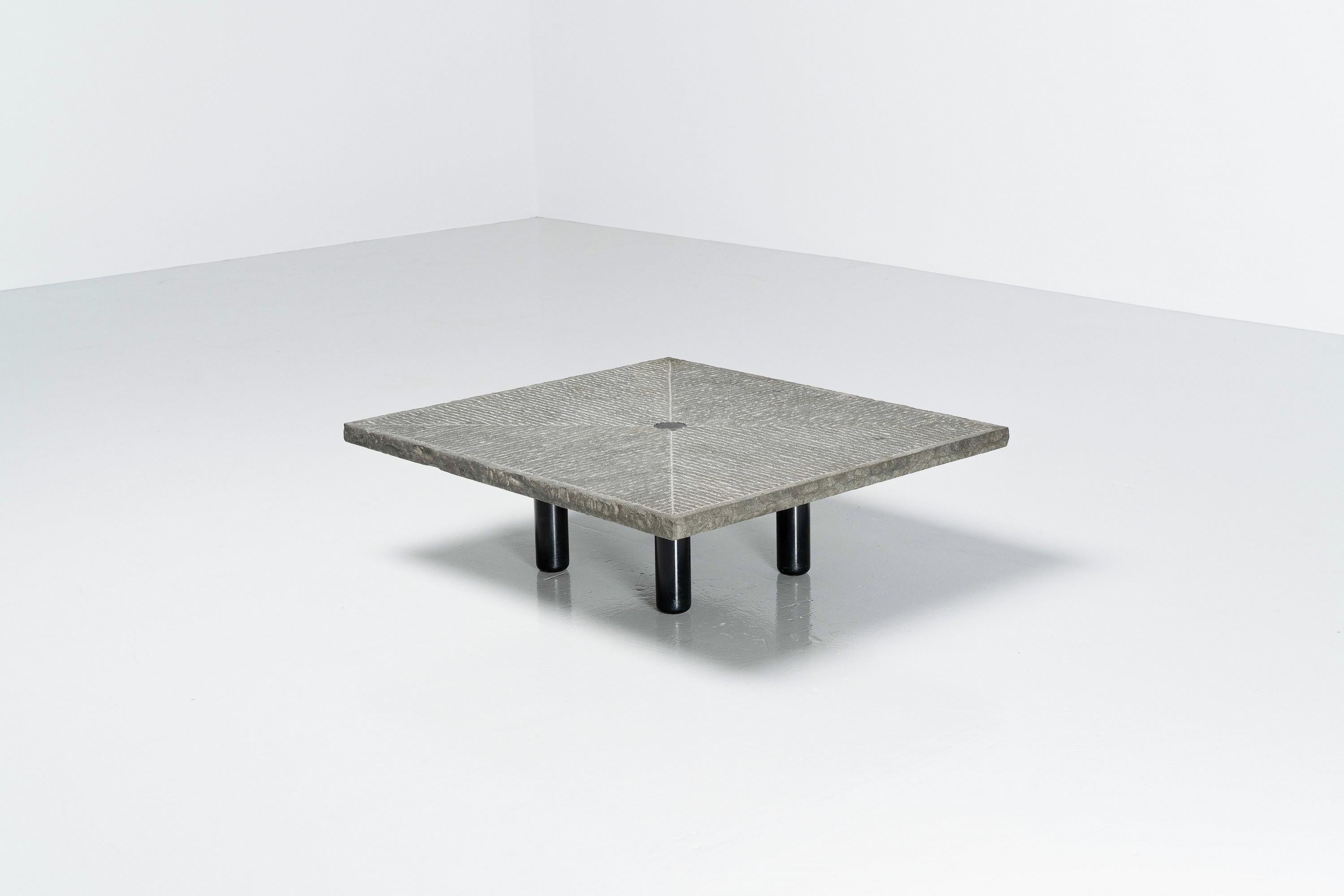 Very quirky and interesting sculptural coffee table designed by architect Giulio Lazzotti and produced by Mageia in Italy, 1981. This table is in good condition and is made of a black painted steel base with an etched grindstone top, with in the