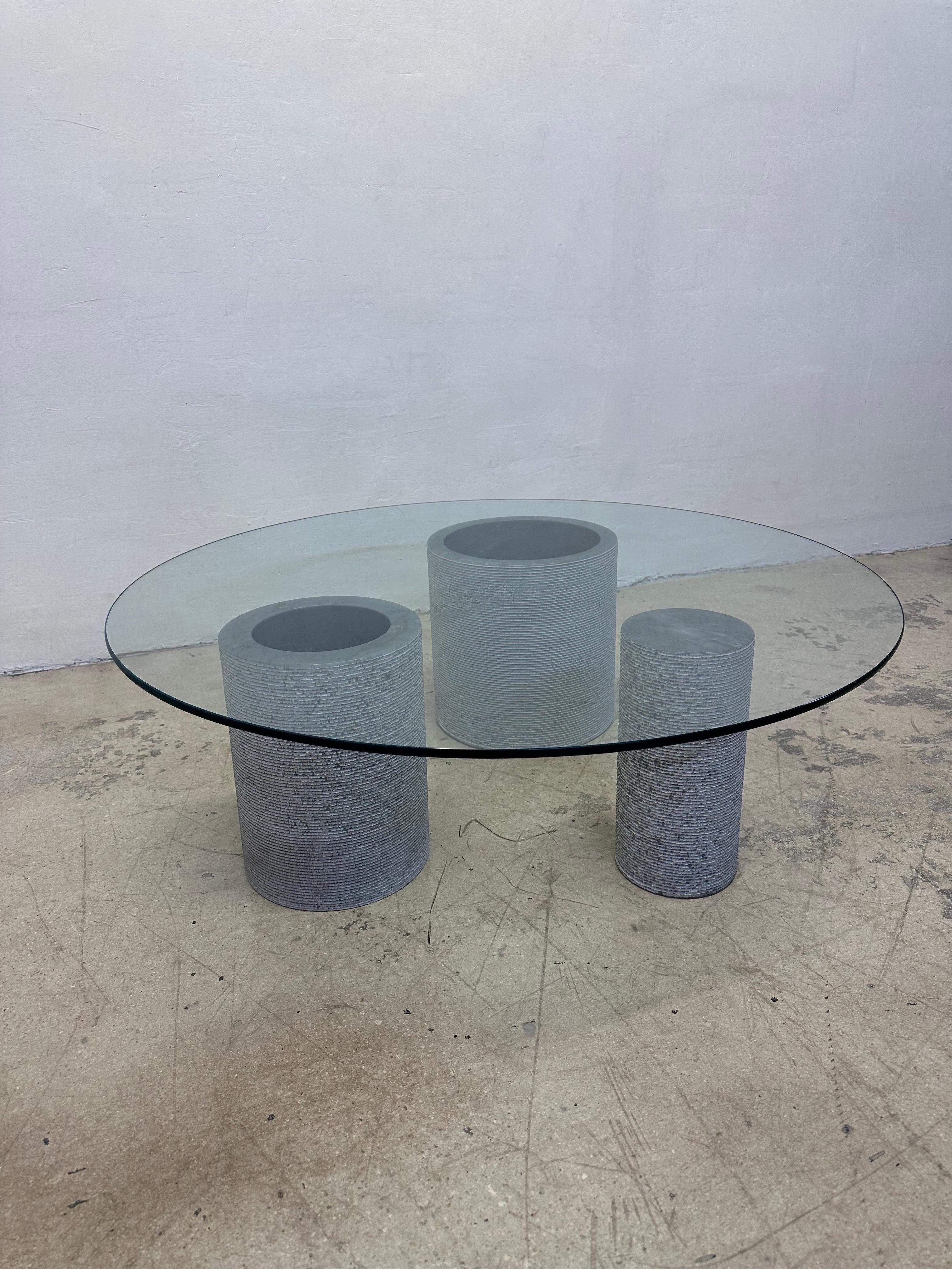 “Of One, Three Designs” uses a single slab of marble to form three separate architectural bases to a coffee table.  This Italian marble table was designed by Giulio Lazzotti for Casigliani circa 1970s.  

The glass top is 3/8”.  Use with existing