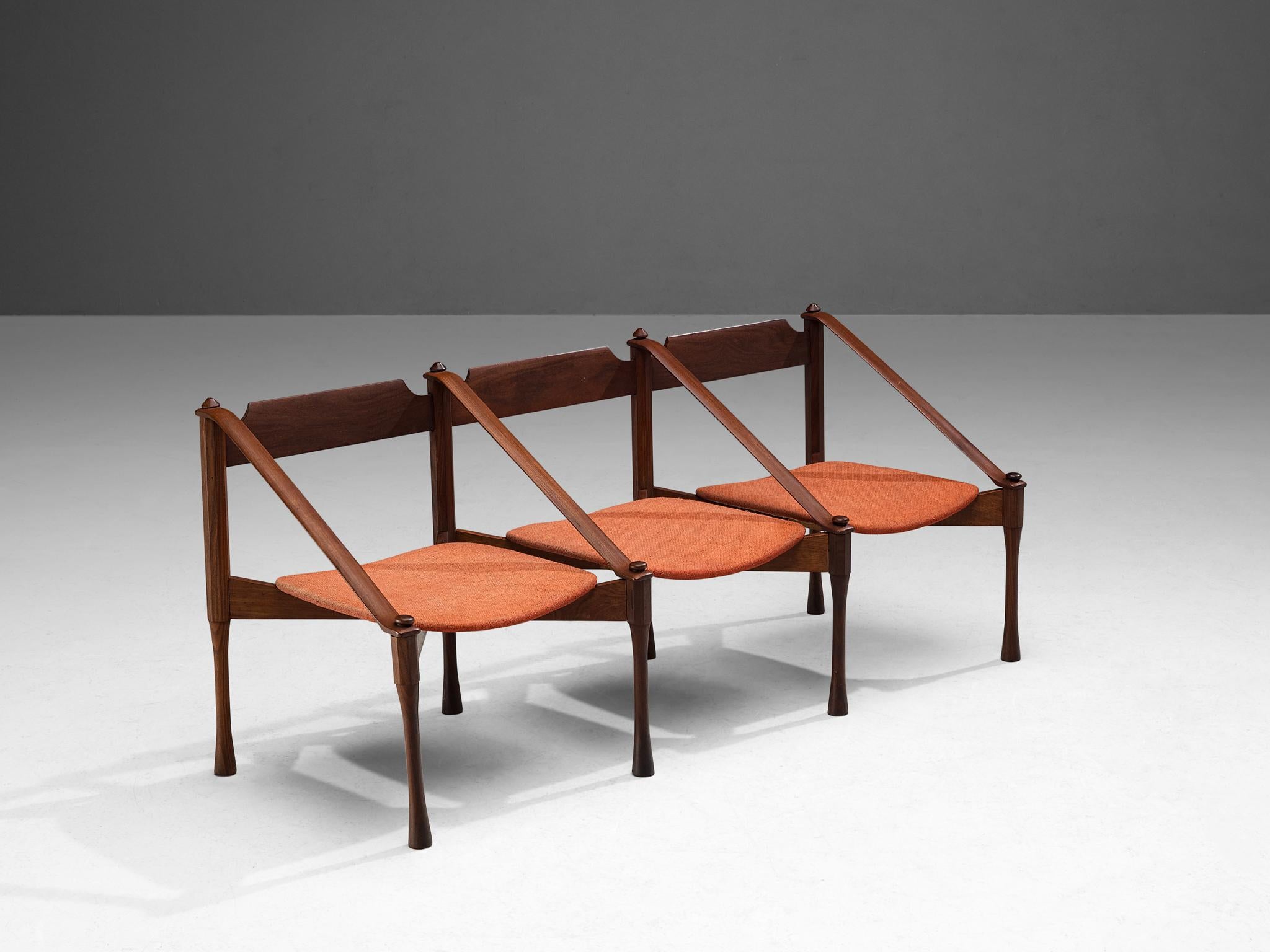 Giulio Moscatelli, bench, teak, fabric, Italy, ca. 1950.

This bench by Giulio Moscatelli is distinctive in its execution. The legs are beautifully sculpted, showing concave carvings. The diagonal placed armrests give a sense of dynamism. A quite