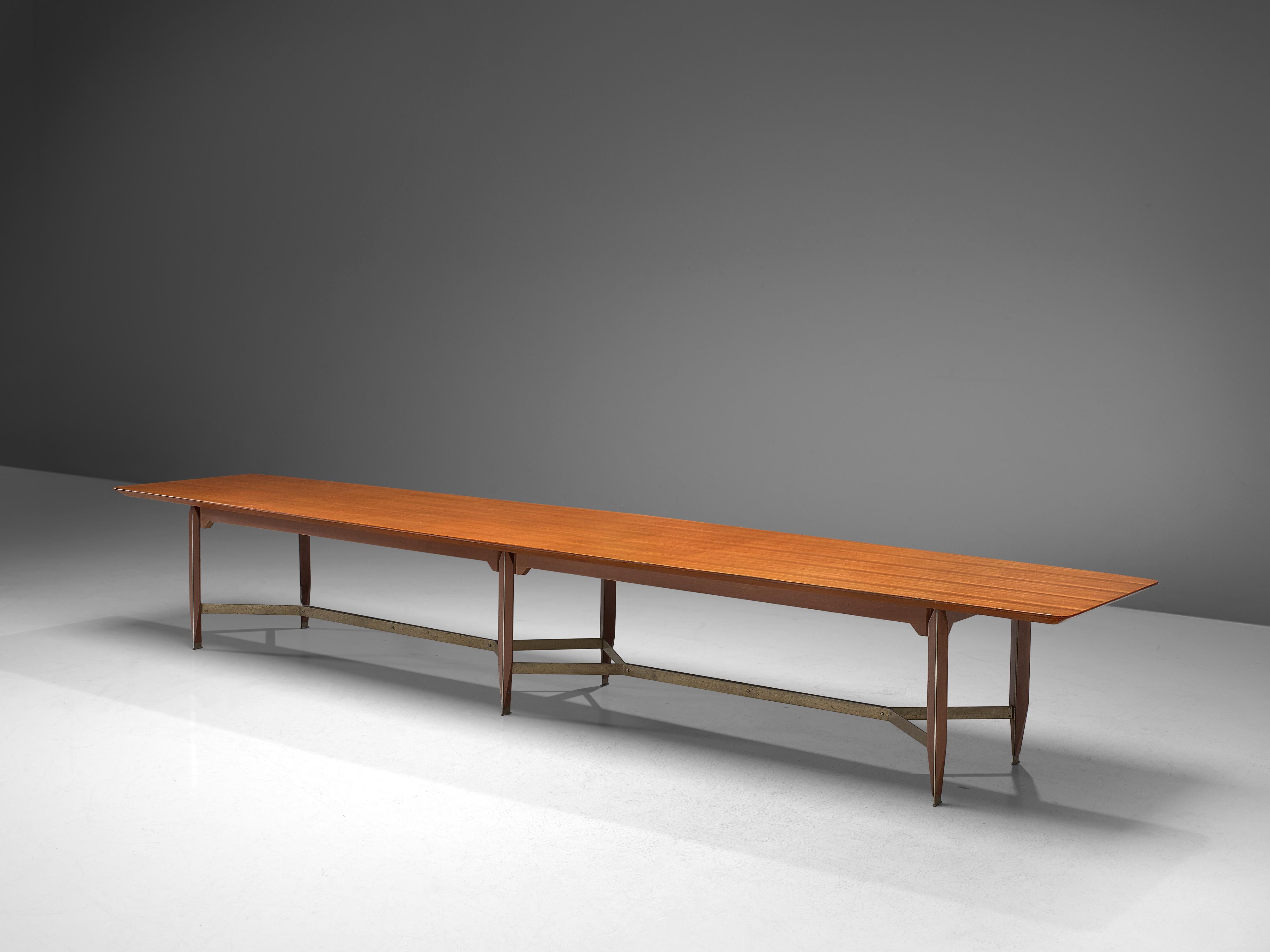 Giulio Moscatelli, conference table, teak, pattinated metal, brass, Italy, 1970s

Very large 5 meter conference table designed by Giulio Moscatelli. The tabletop is slightly boat shaped and features a notable base. The six legs are made of teak and