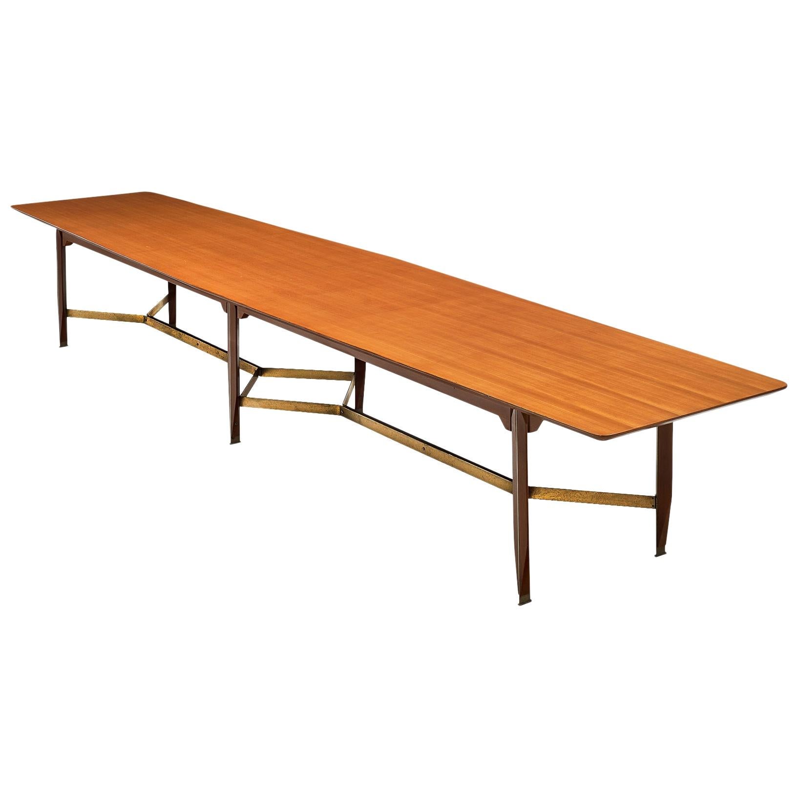 Giulio Moscatelli, conference table, teak, metal and brass, Italy, 1970s.

Very large conference table designed by Giulio Moscatelli. The tabletop is slightly boat shaped and features a notable frame. The six legs are made of teak and a metal strip,