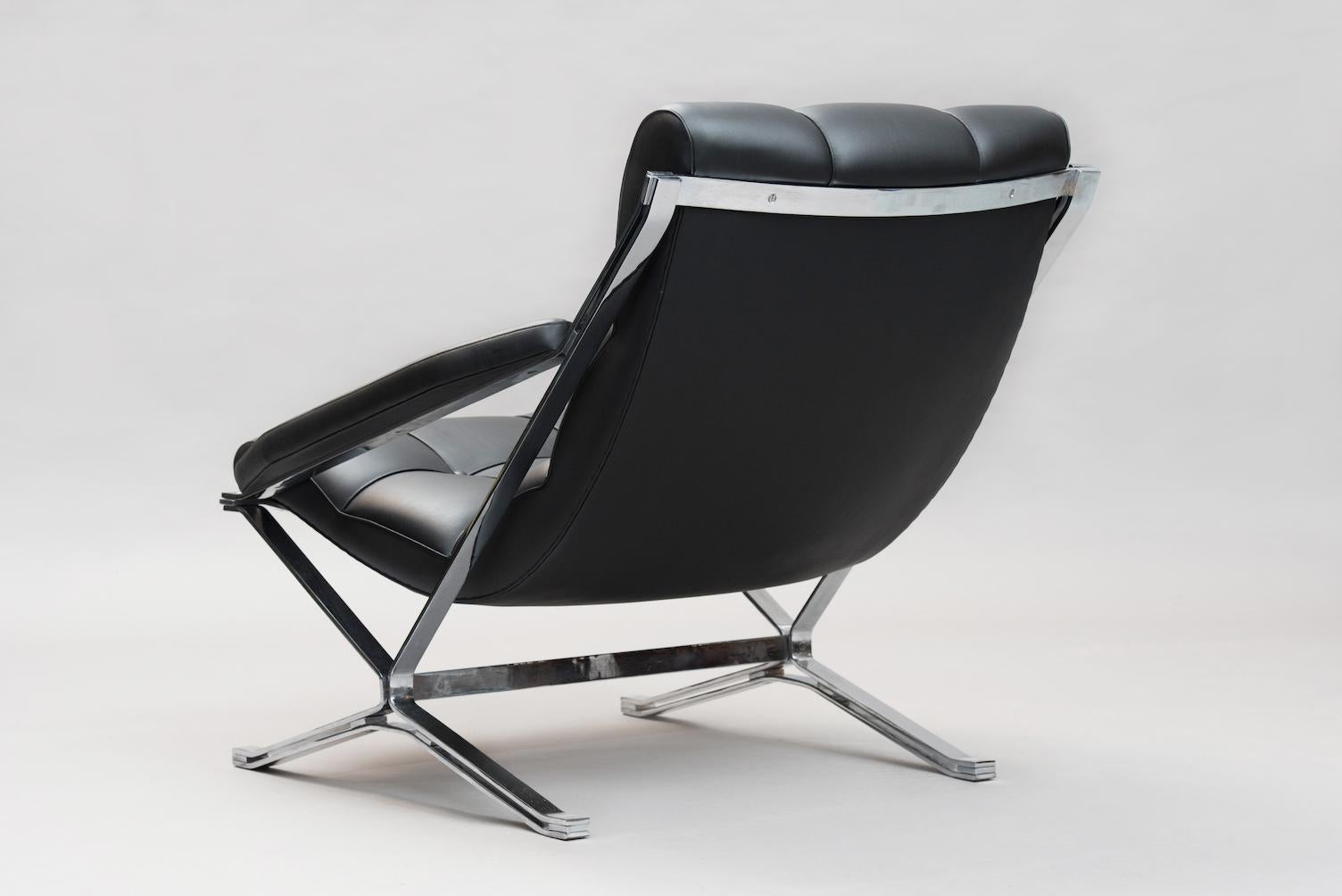 Armchair by Giulio Moscatelli for Formanova, chromed steel X-shaped supports, reupholstered in black eco-leather.
 