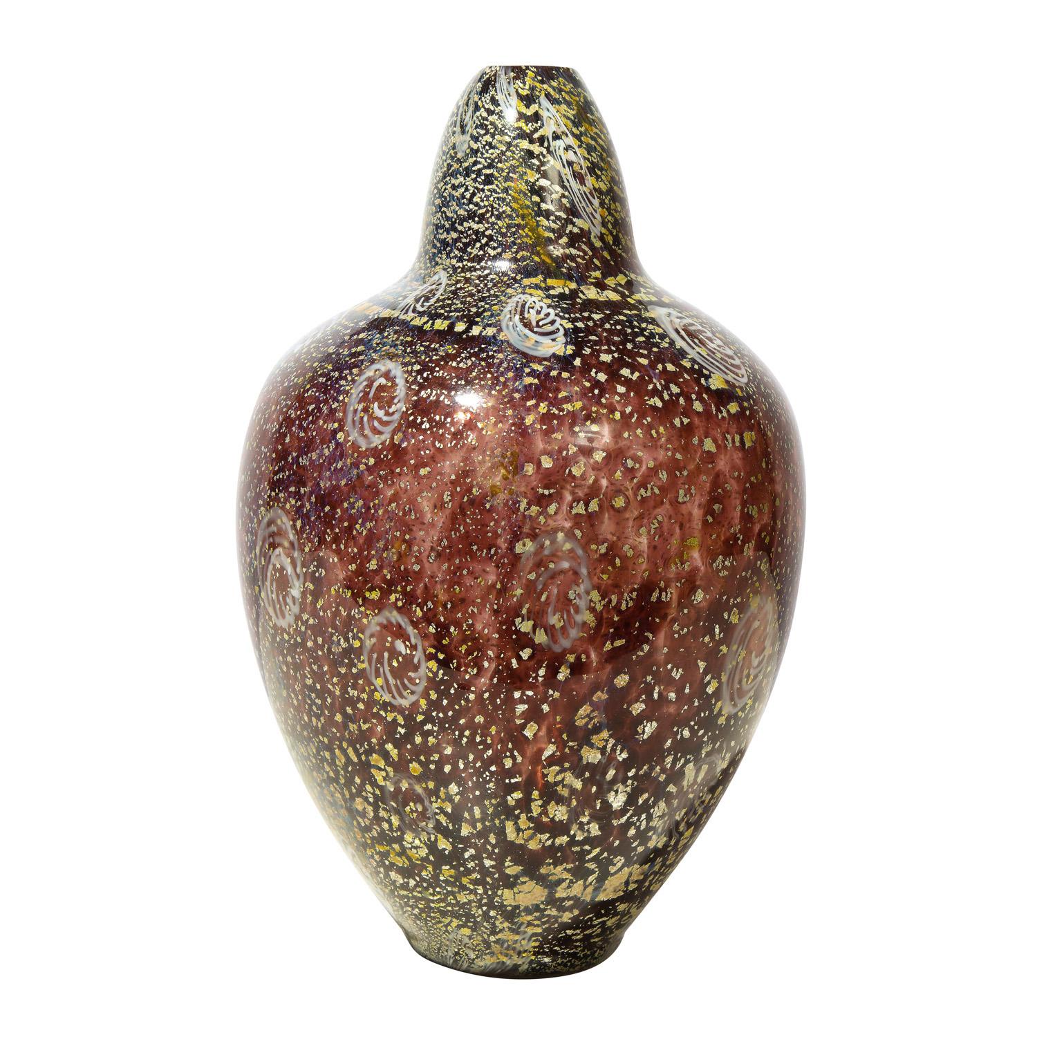 Hand-blown amber glass vase with gold foil and murrhines, from the Reazione Policrome Series, Ad Anelli by Giulio Radi for Arte Vetraria Muranese or A.V.E.M., Murano Italy, ca 1950.

Reference:
AVEM Artistic Production 1932-1972 by Marc Heiremans