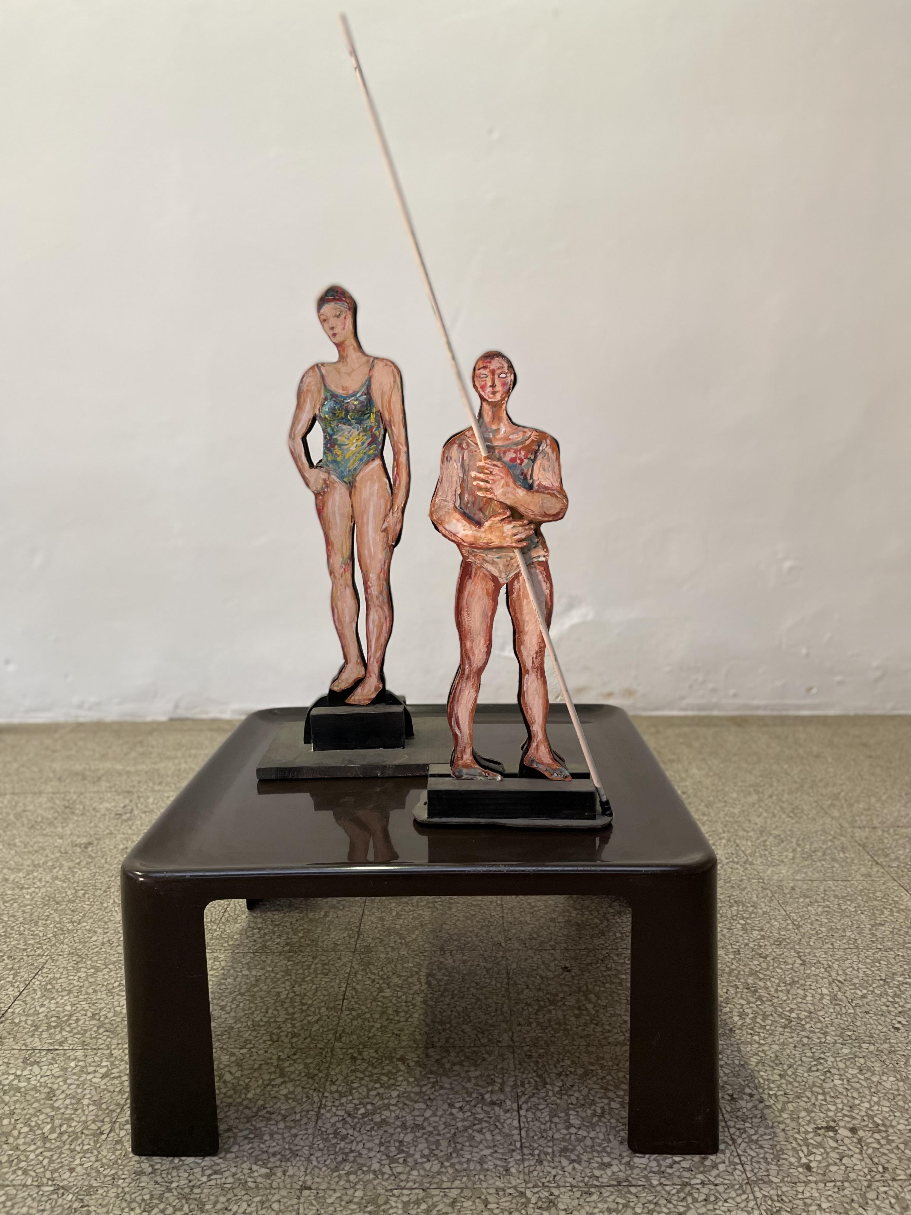 Introducing a stunning pair of hand painted wood sculptures by renowned artist Giuseppe Bacci (Aris Bacci's son), titled 