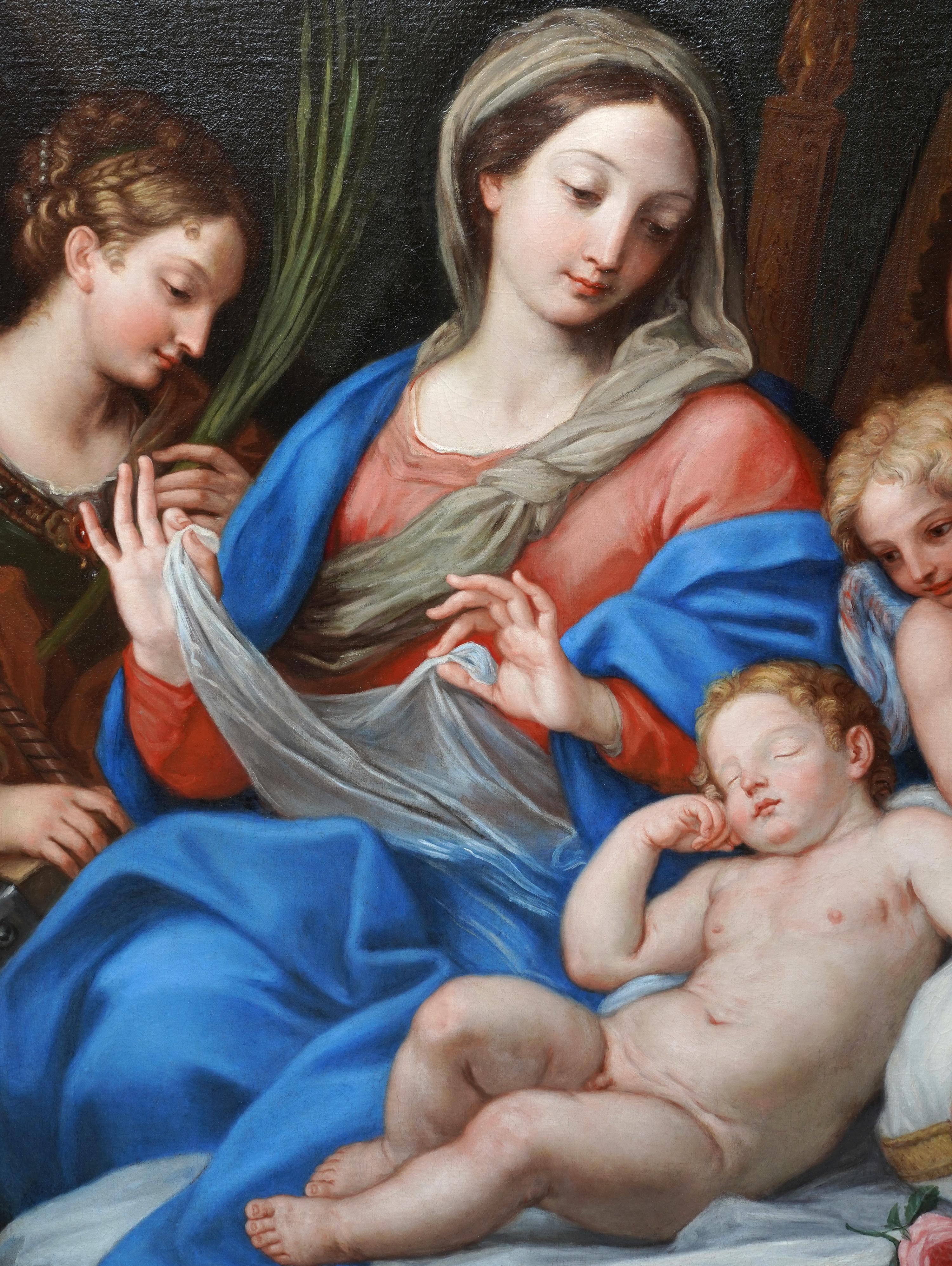 This stunning Italian 17th century Old Master religious oil painting is by Baroque artist Giuseppe Bartolomeo Chari. Painted circa 1684 it is a large and vibrant oil painting of the Madonna and child. To their left is Saint Catherine and to their