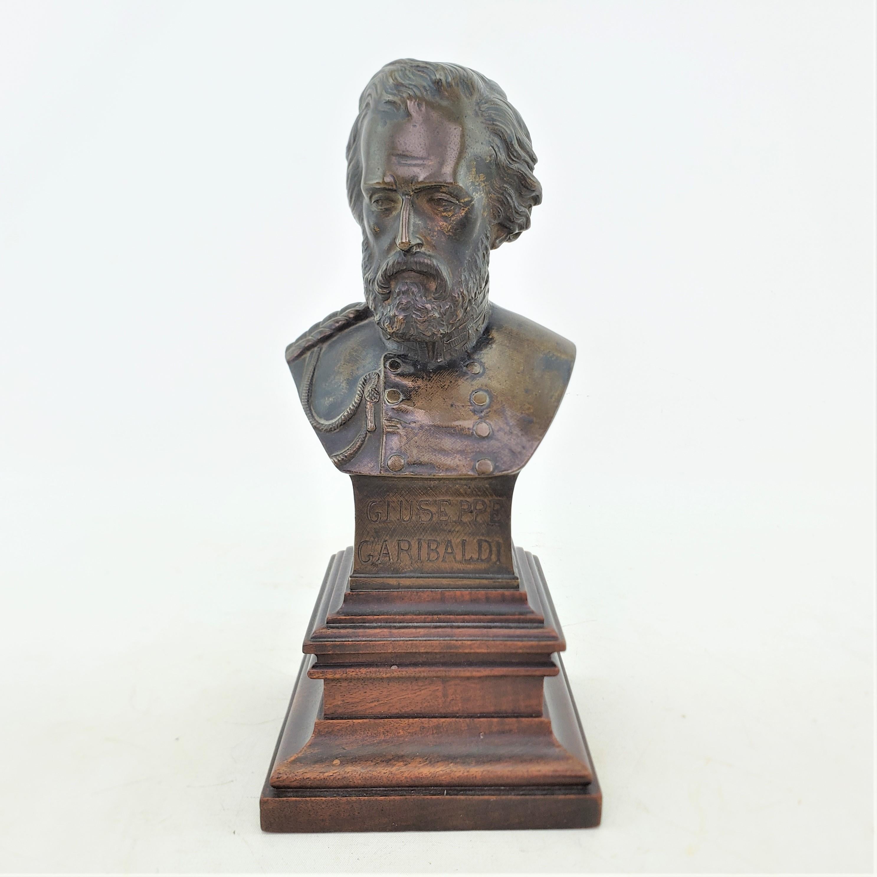 This antique bronze sculpture may be signed on the back by an unknown artist and presumed to date to approximately 1900 and originate from Italy. The well executed bronze sculpture depicts the very famous Italian, Giuseppe Garibaldi in a military