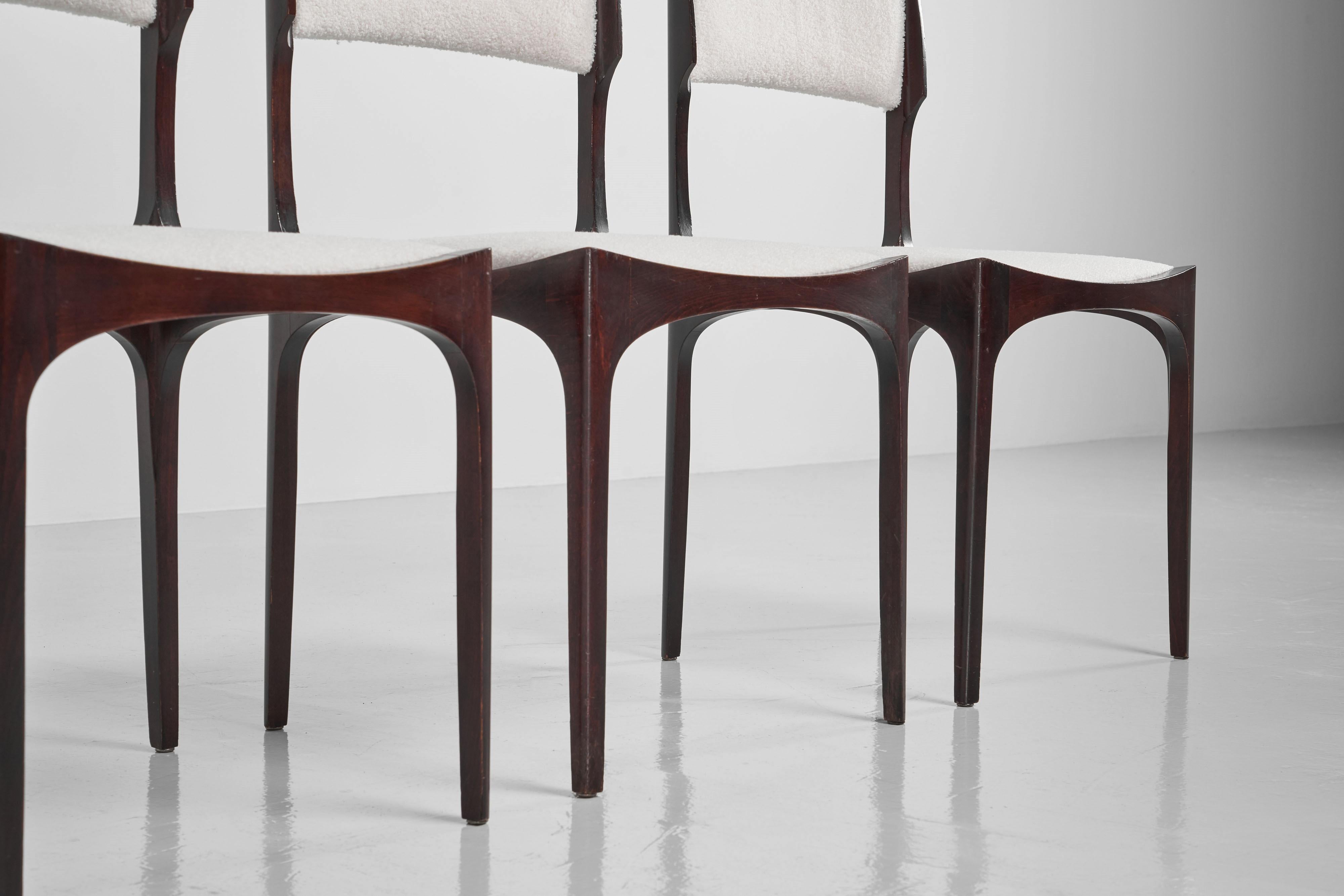Highly refined set of 6 ‘Elisabetta’ dining chairs designed by Giuseppe Gibelli and manufactured by Sormani, Italy 1963. The chairs have a solid ash wooden frame which is finished with a mahogany stain which is towards a red brown colour like