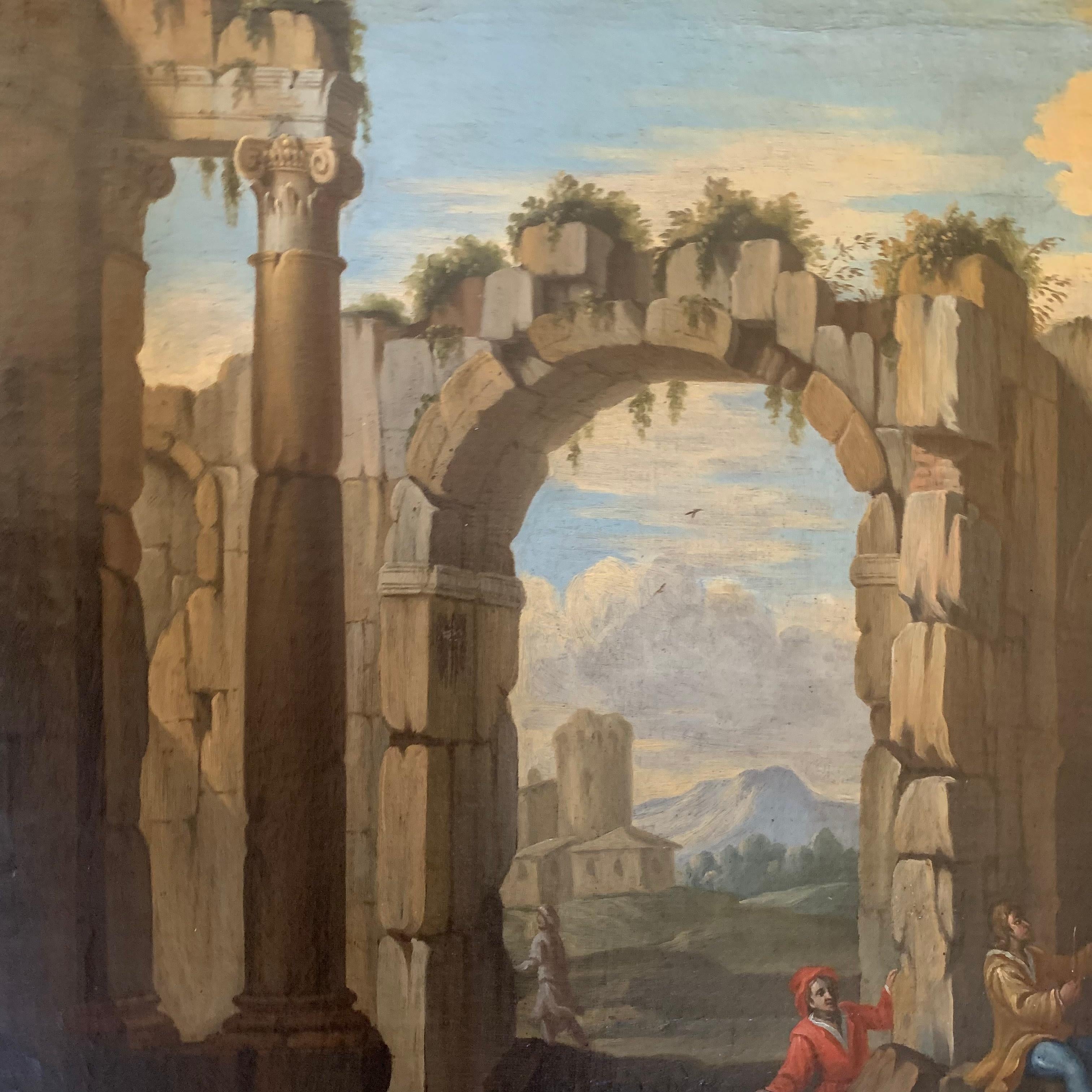 Roman school. Lazio landscape. Early 18th century.
Architectural Capriccio with Ancient Rome ruins with arches and a temple to the left with columns and mountains in the distance. In the foreground are three characters dressed in the traditional