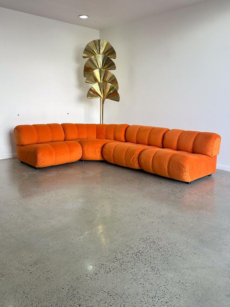 Italian Mid Century Modern orange set of four modular sofa by Giuseppe Munari for Poltronova 1970s.

Newly professionally reupholstered in Italy with Orange fabric. 

A modular sofa is a versatile seating solution that consists of individual