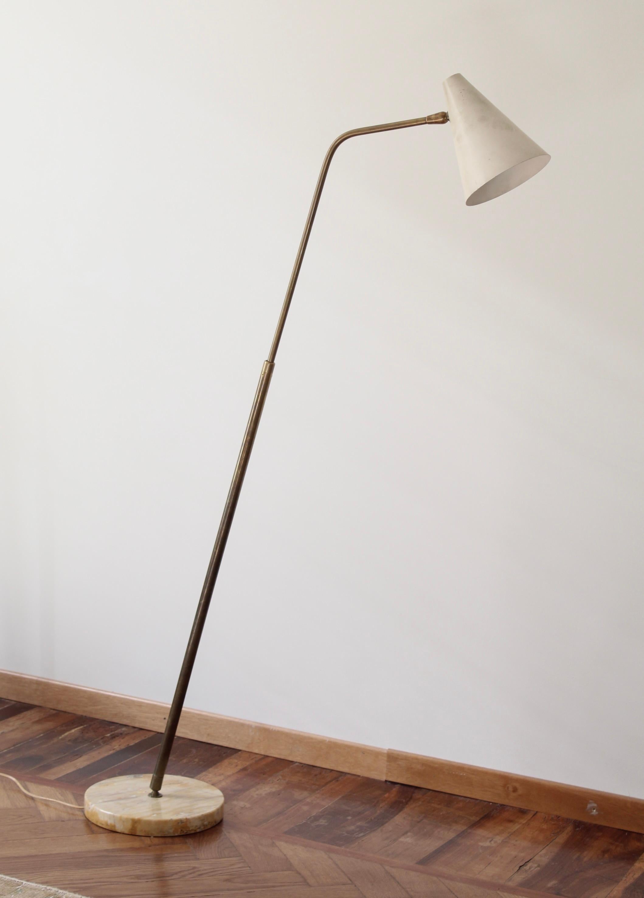 An adjustable brass, white-lacquered metal and marble floor lamp designed by Giuseppe Ostuni and produced by O-Luce, Italy, c. 1950s. 

 Dimensions variable, measured as illustrated in primary image.