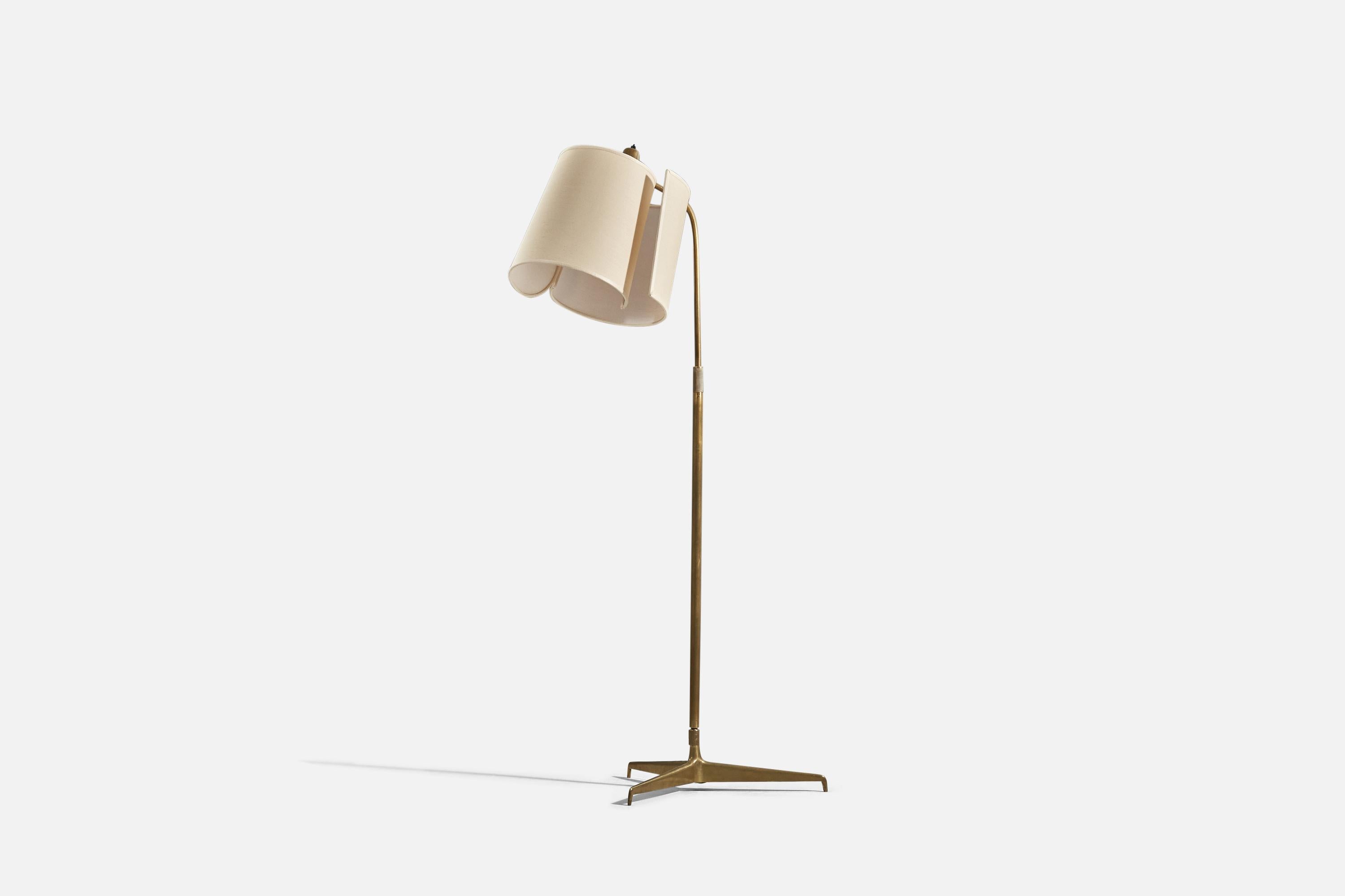 A brass and fabric floor lamp designed by Giuseppe Ostuni and produced by O-Luce, Italy, c. 1950s. 

 