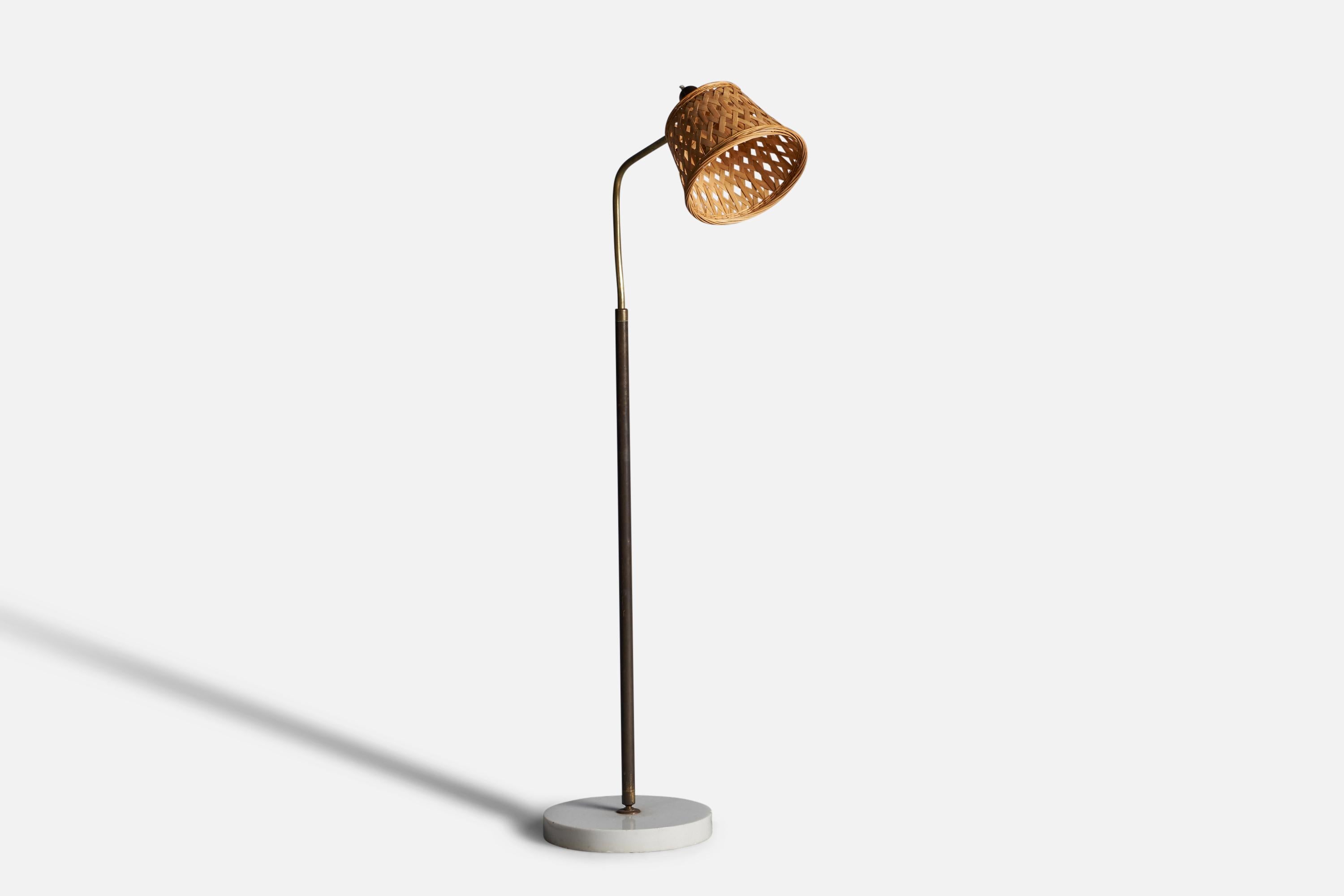 An adjustable brass, marble and rattan floor lamp, designed by Giuseppe Ostuni, and produced by O-Luce, Italy, 1950s.

Overall Dimensions: 51