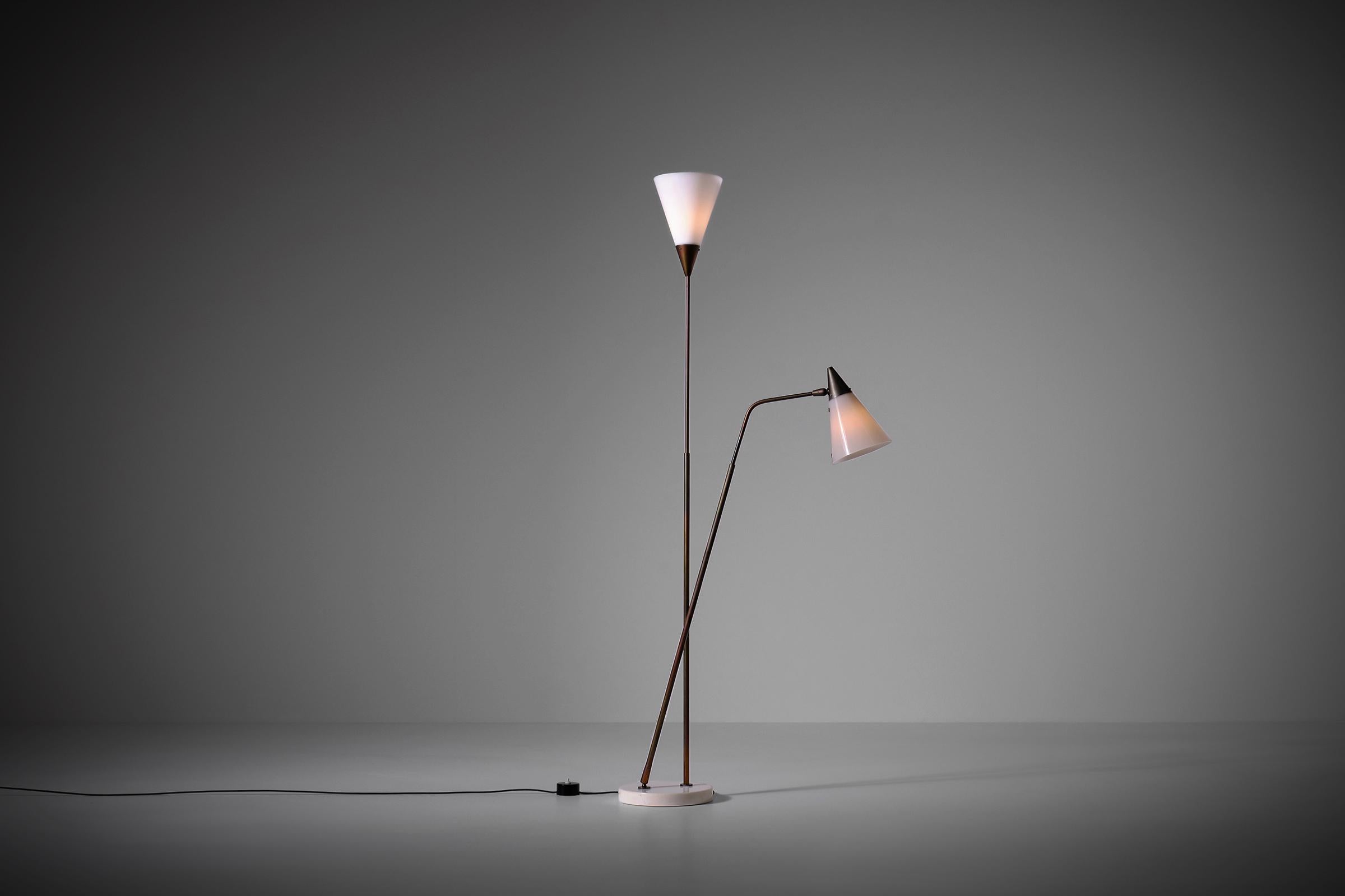 Rare adjustable floor lamp mod. 339-2 PX by Giuseppe Ostuni for O-Luce, Italy 1952. Unusual model with duo colored perspex shades; one in opal white and one in warm grey. Very intelligent design with inventive technical details such as the