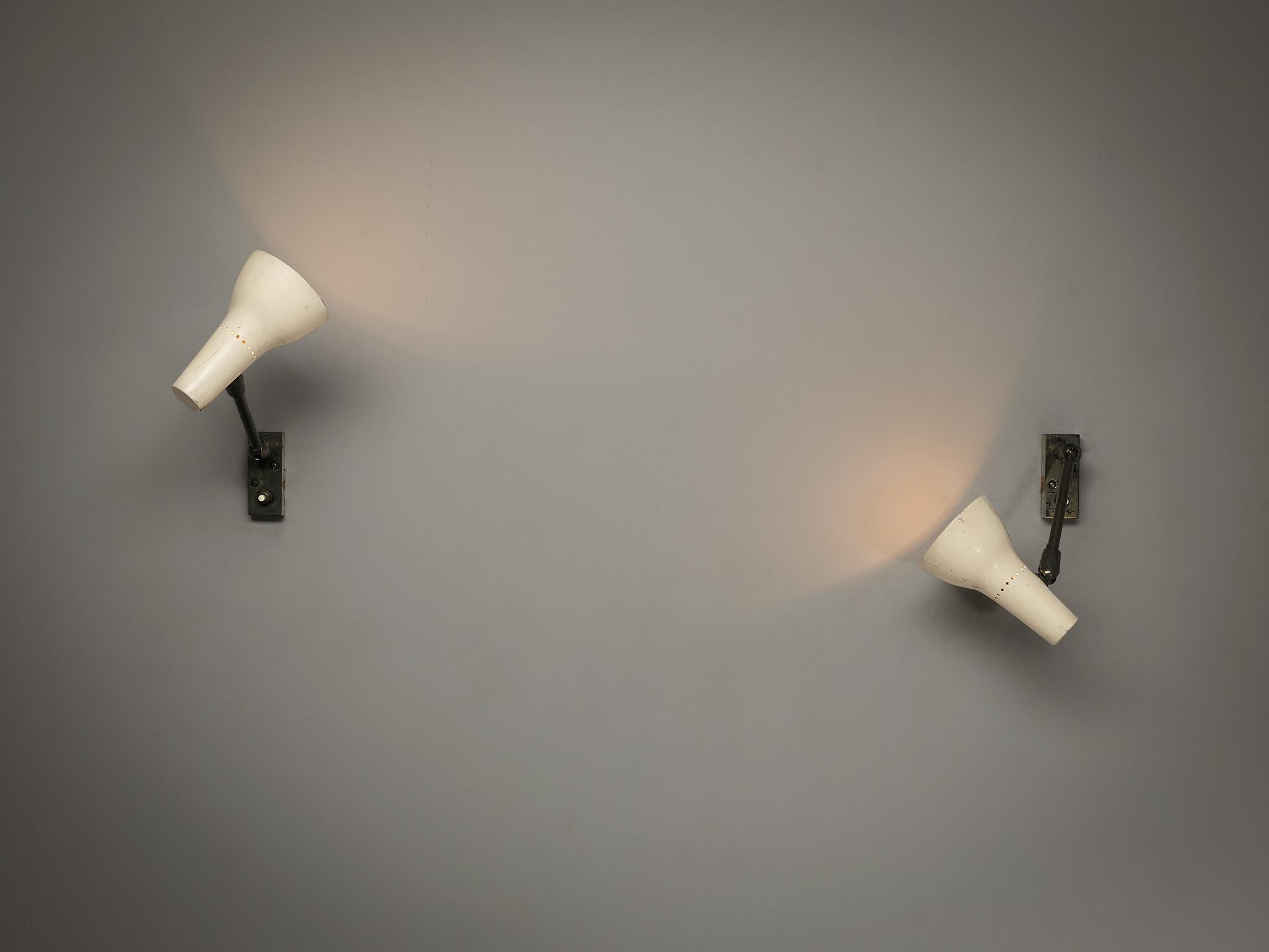 Giuseppe Ostuni for O-Luce, pair of wall lights, variation of model 109, nickel-plated brass, enameled aluminum, Italy, 1951 

This rare wall light is the derivative of model 109 and features a streamlined design. Clear in its appearance, use of