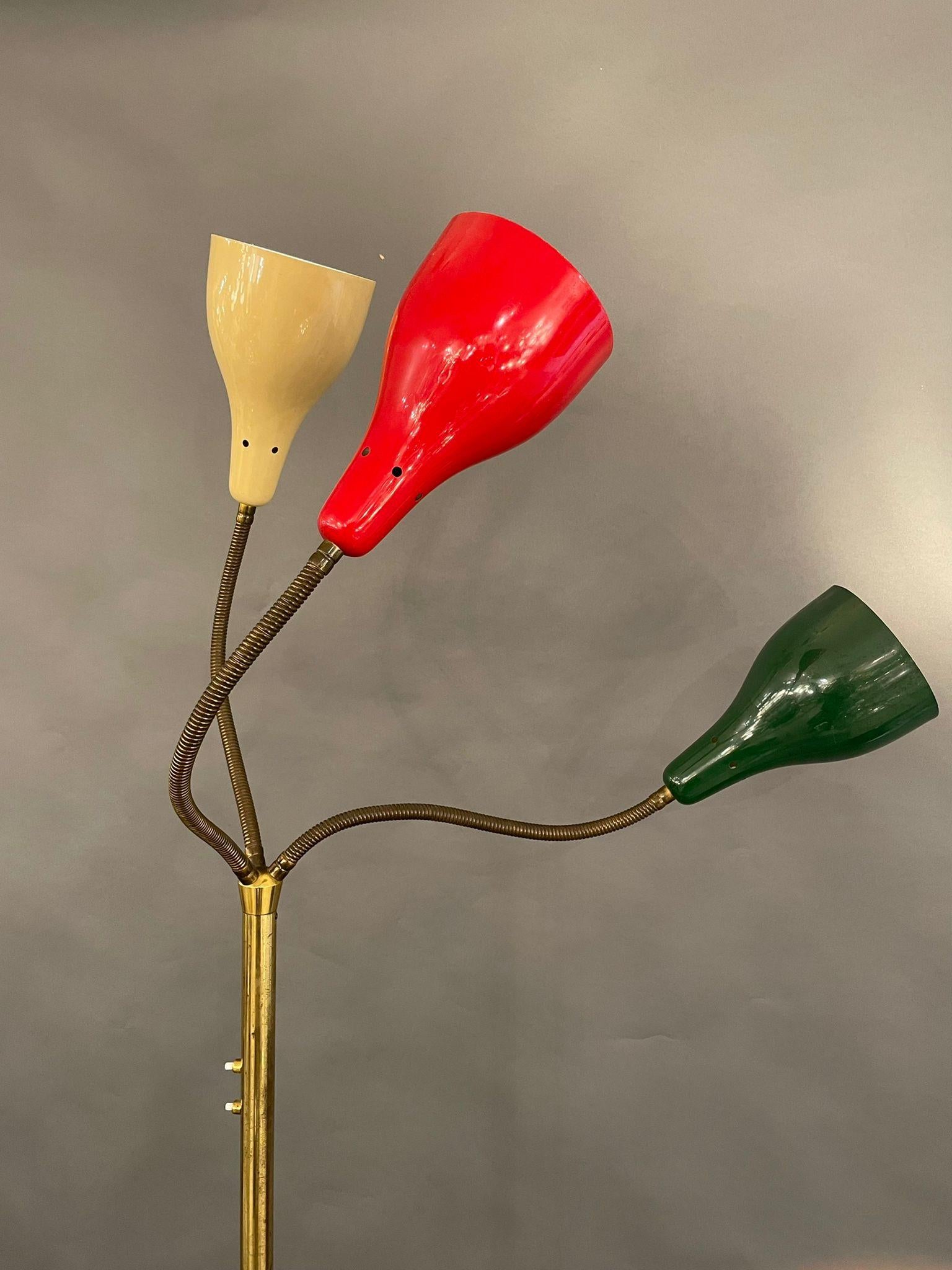 Rare Floor lamp by Giuseppe Ostuni, OLuce, Italy, 1950.

Polished brass, 3 flexible arms with origin painted reflectors
red, white, green

The lamp is in good vintage condition.