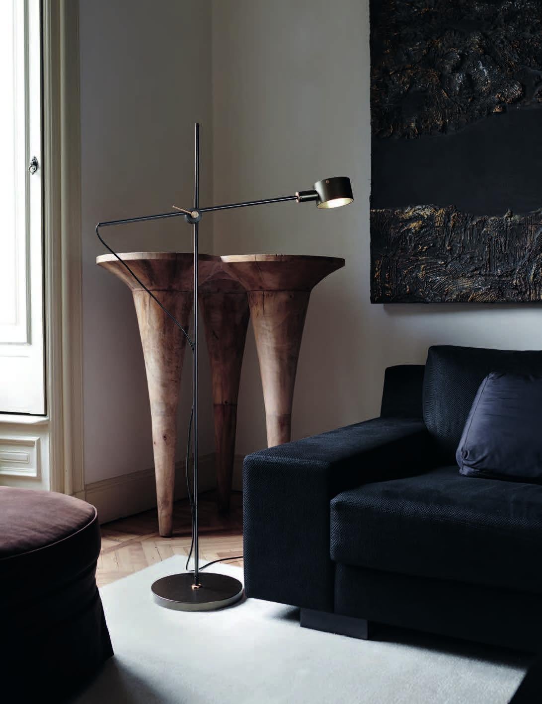 Giuseppe Ostuni Model 352 'G.O.' floor lamp in black for Oluce. 

Originally designed by Giuseppe Ostuni in the 1960s, this iconic re-edition is still crafted by Oluce in Italy using many of the original manufacturing techniques with scrupulous