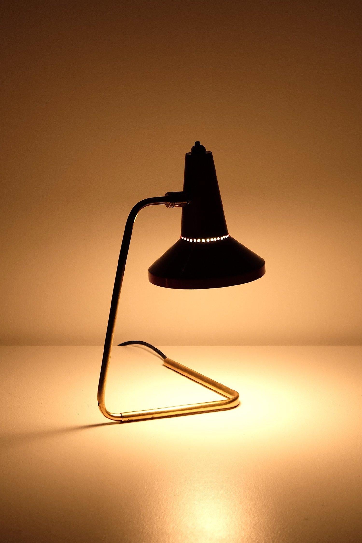 Rare Giuseppe Ostuni Oluce desk lamp #223 made in Italy. Lacquered aluminium shade, brass stem and foot. 40 watts max E-12 North American bulb recommended or higher if LED/CFL.

Rewired with a E-12 candelabra base socket, 18/2 black plastic cord