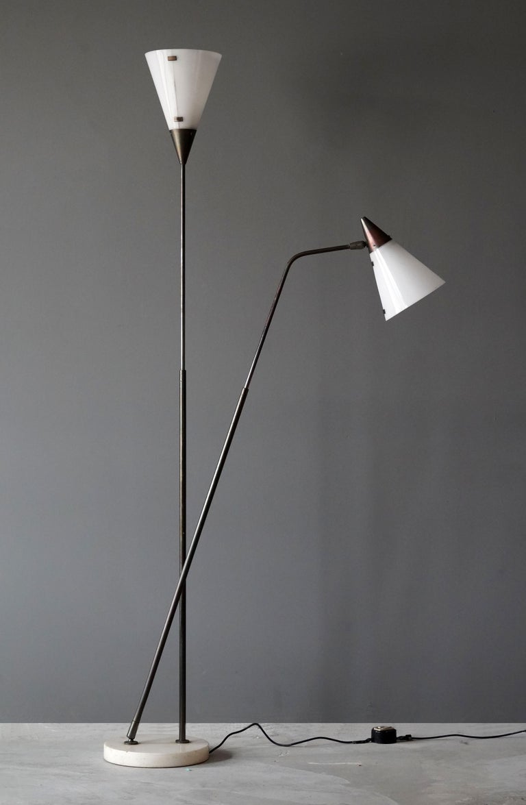A rare model two-armed adjustable functionalist floor lamp. Designed by Guiseppe Ostuni and produced by O-Luce, Italy, 1950s. Rare execution with original acrylic lampshades.

Other designers of the period working in similar style include Max