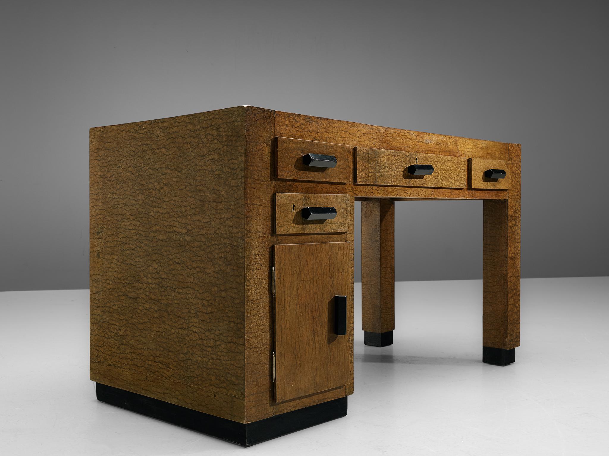 Giuseppe Pagano and Gino Levi Montalcini for F.I.P. Torino, lacquered wood, buxus paper, brass, Italy, 1929.

This desk is designed by Pagano and Montalcini for Palazzo degli Uffici Gualino. This golden brown desk on a black base is part of a