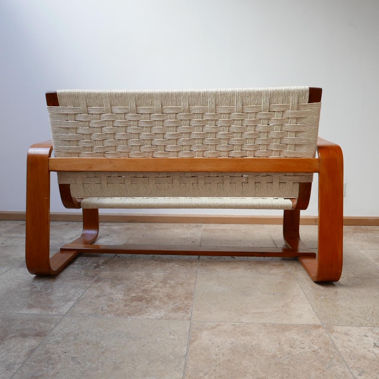 Midcentury two-seat sofa by Giuseppe Pagano.
Italy, circa 1942.
Minimalist curved design, formed from layers of plywood.
The seats have been re-corded professionally as such the armchairs are immaculate.
Price is for the sofa only.
Dimensions: