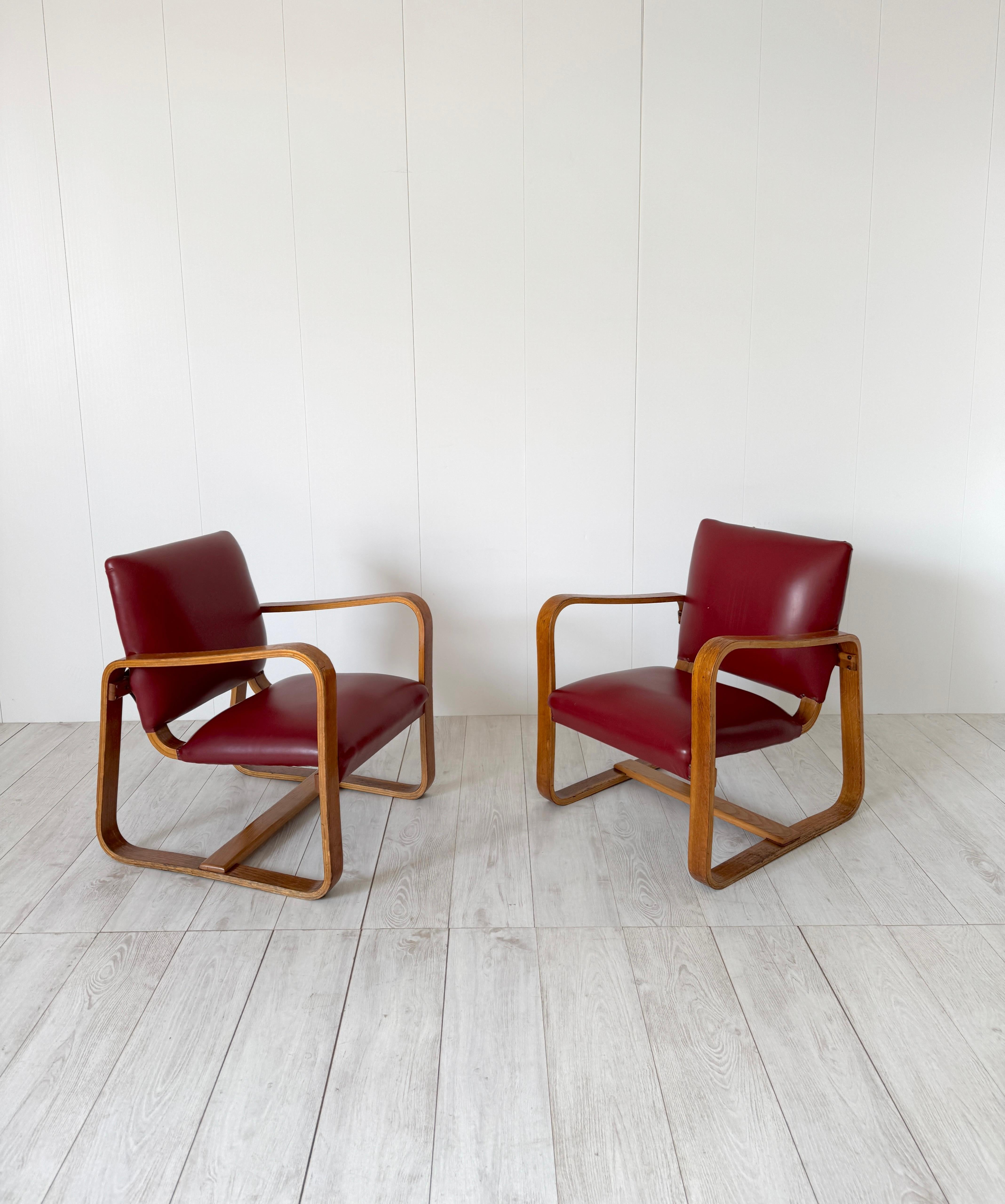 Pair of armchairs mod. Lamellare 
Bent wood frame and vinyl leather upholstery.
Original design for the furnishings of Bocconi Commercial University.
Prod. Maggioni, Italy, 1941

Giuseppe Pagano was the architect of Bocconi University's historic