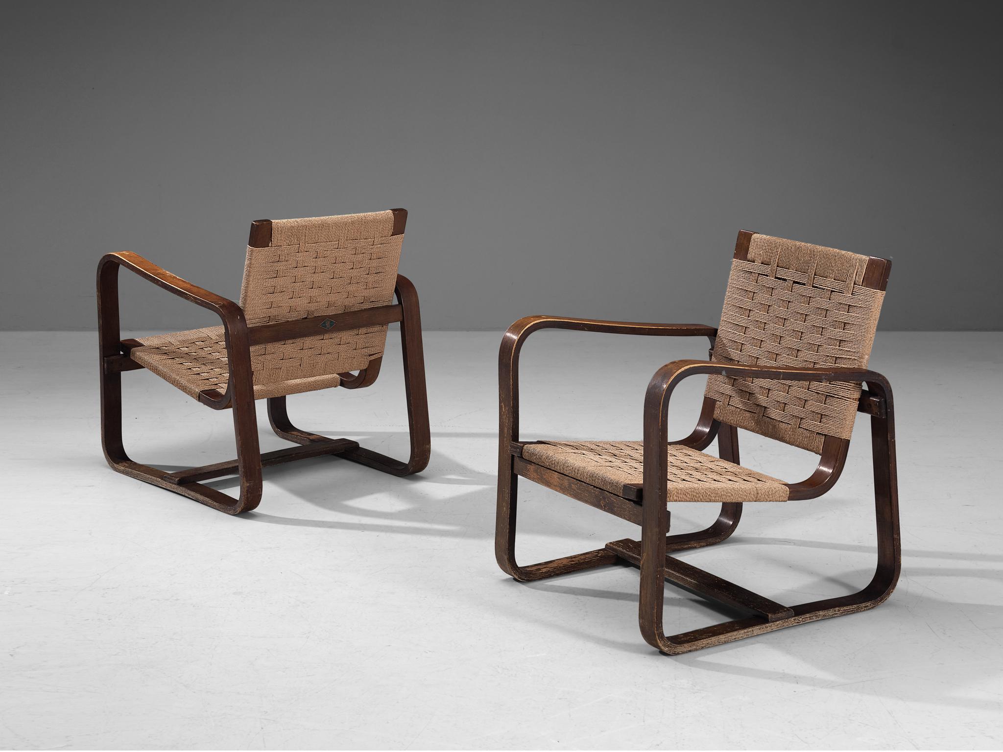 Giuseppe Pagano Pogatschnig & Gino Maggioni, pair of lounge chairs, walnut, natural cord, Italy, 1940

Giuseppe Pagano Pogatschnig (1896-1945) and Gino Maggioni (1898-1955) designed this bentwood armchair initially in 1940 for ‘l’Università
