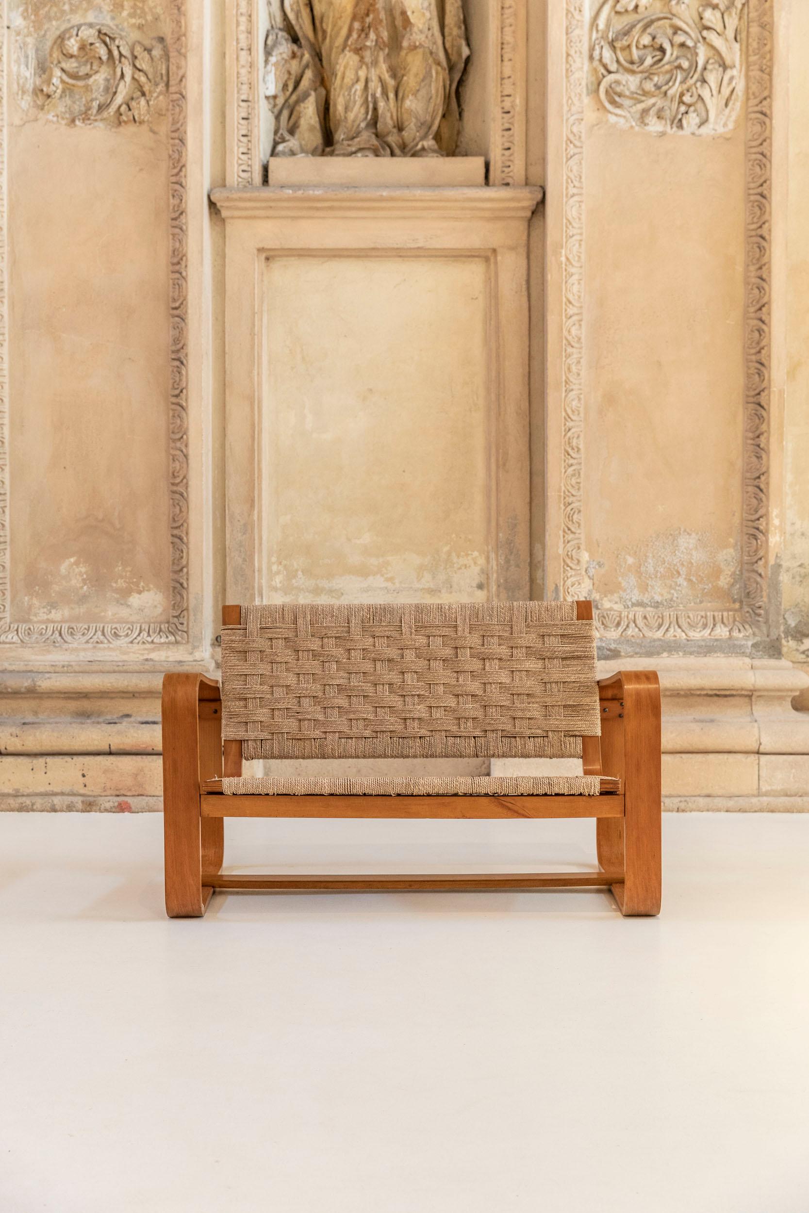 Giuseppe Pagano Pogatschnig and Gino Maggioni. 
Sofa mod. Lamellar with wooden frame and rope seat. 
Original design for the furniture of the Bocconi University. 
Prod. Maggioni, Italy, 1941
The item present the original label in the back.