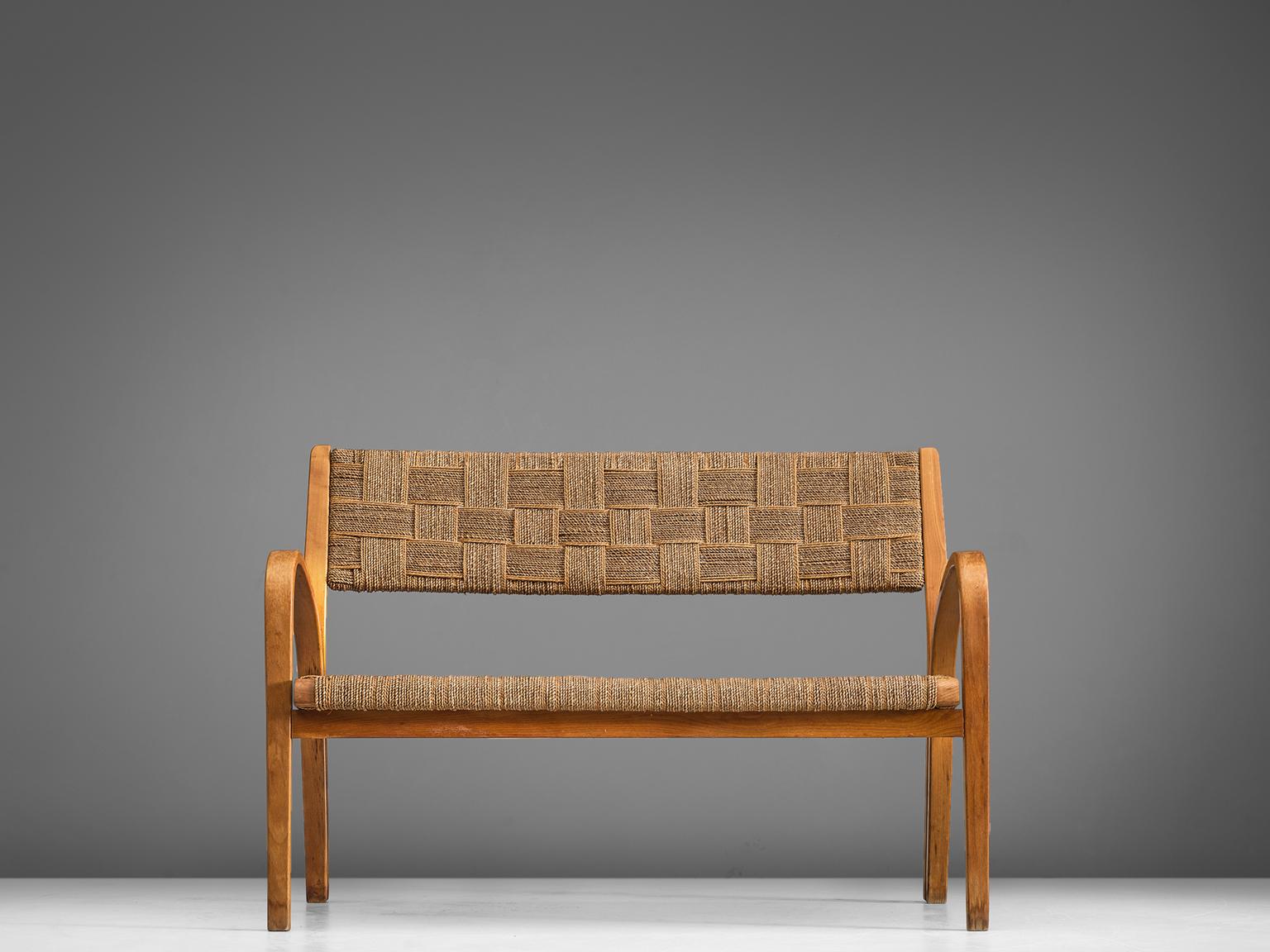 Sofa attributed to Giuseppe Pagano, curved wooden structure coated rope, Italy, 1940s.

This sofa is executed in wood and coated rope. The design of this Italian sofa is Minimalist yet not in a Puritan way. The armrests seem to rise upwards and