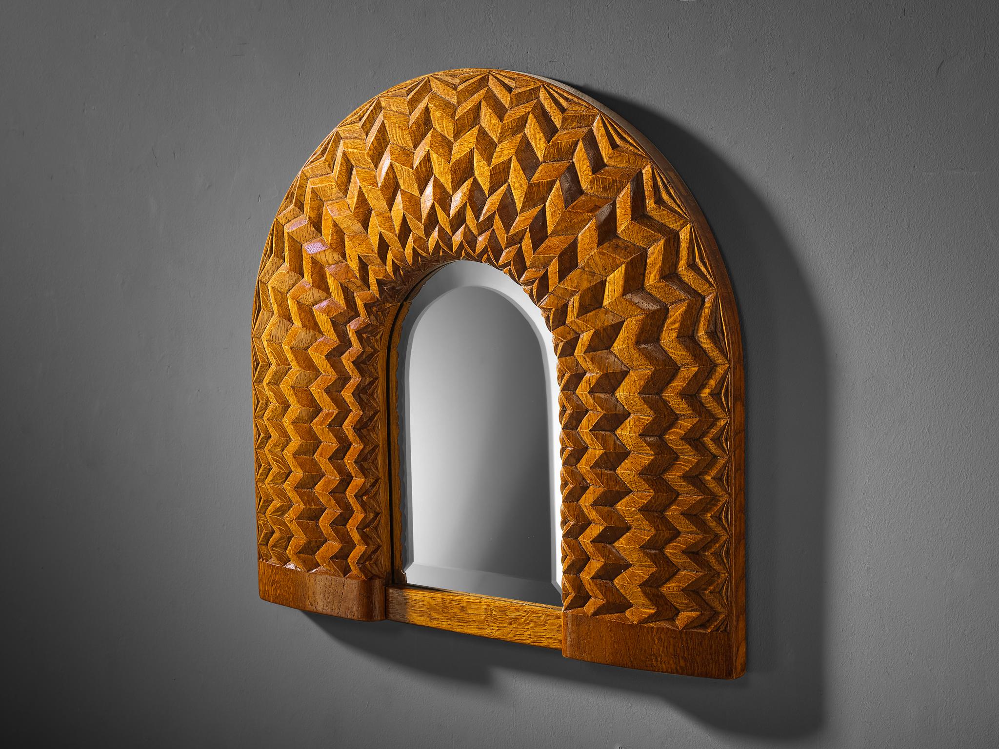 Giuseppe Rivadossi, oak, mirrored glass, Italy, 1970s

This delightful mirror, designed by Italian sculptor and artisan Giuseppe Rivadossi, is a good example of woodworking artistry. Its striking design features an arched framework with a series of