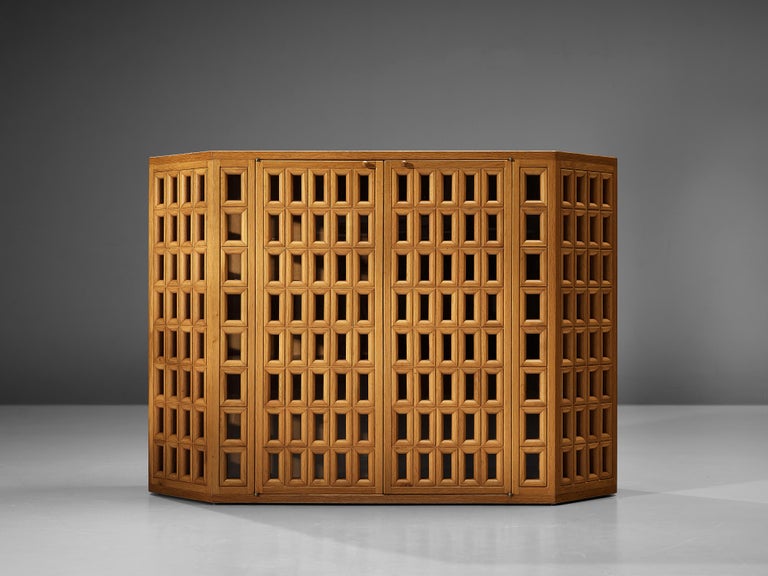 Giuseppe Rivadossi, sideboard model ‘Della Siepe’, oak, glass, brass, Italy, designed in the 1980s

This striking sideboard by Giuseppe Rivadossi pleases the eye by all means. Rivadossi, an Italian sculptor and furniture designer, is known for his
