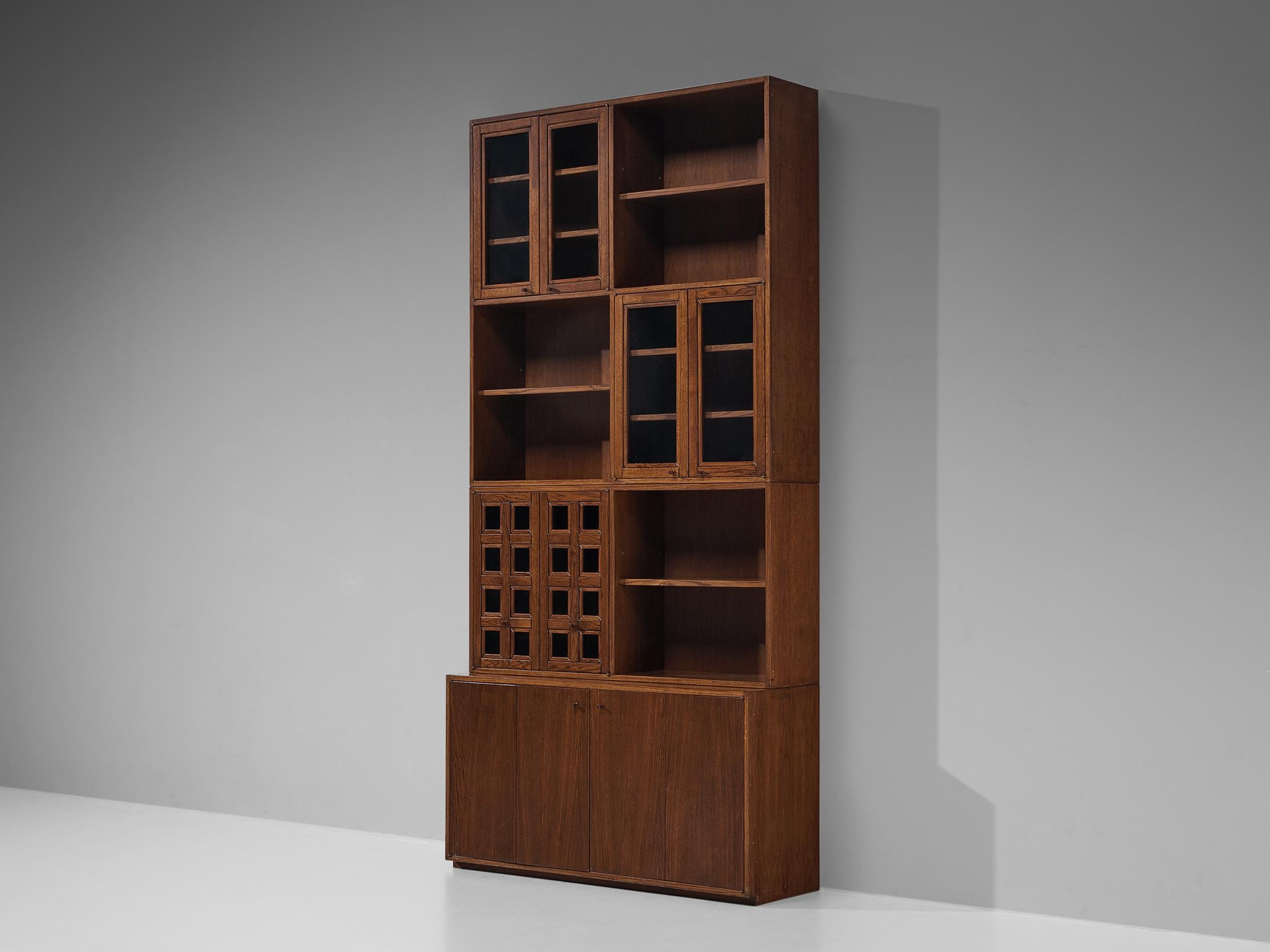 Giuseppe Rivadossi, bookcase, oak, glass, Italy, 1975.

An exceptional library by the Italian sculptor and designer Giuseppe Rivadossi, featuring a high level of craftsmanship in woodwork. The sideboard offers plenty of space to display books and