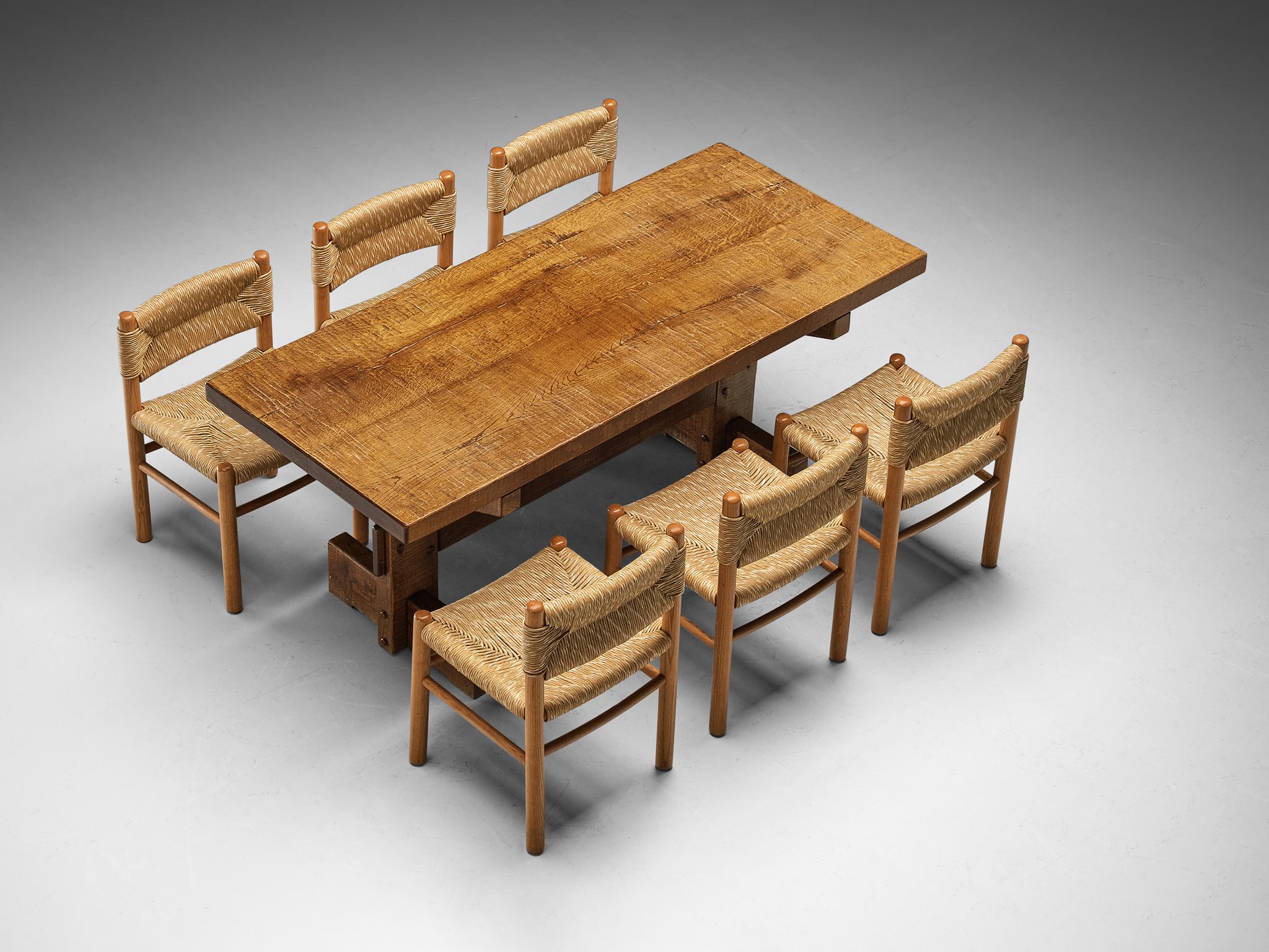 Dining room set consisting of Giuseppe Rivadossi for Officina Rivadossi dining table with set of six French dining chairs 

Giuseppe Rivadossi for Officina Rivadossi, dining table, oak, Italy, 1970s.

Giuseppe Rivadossi once again proves his great