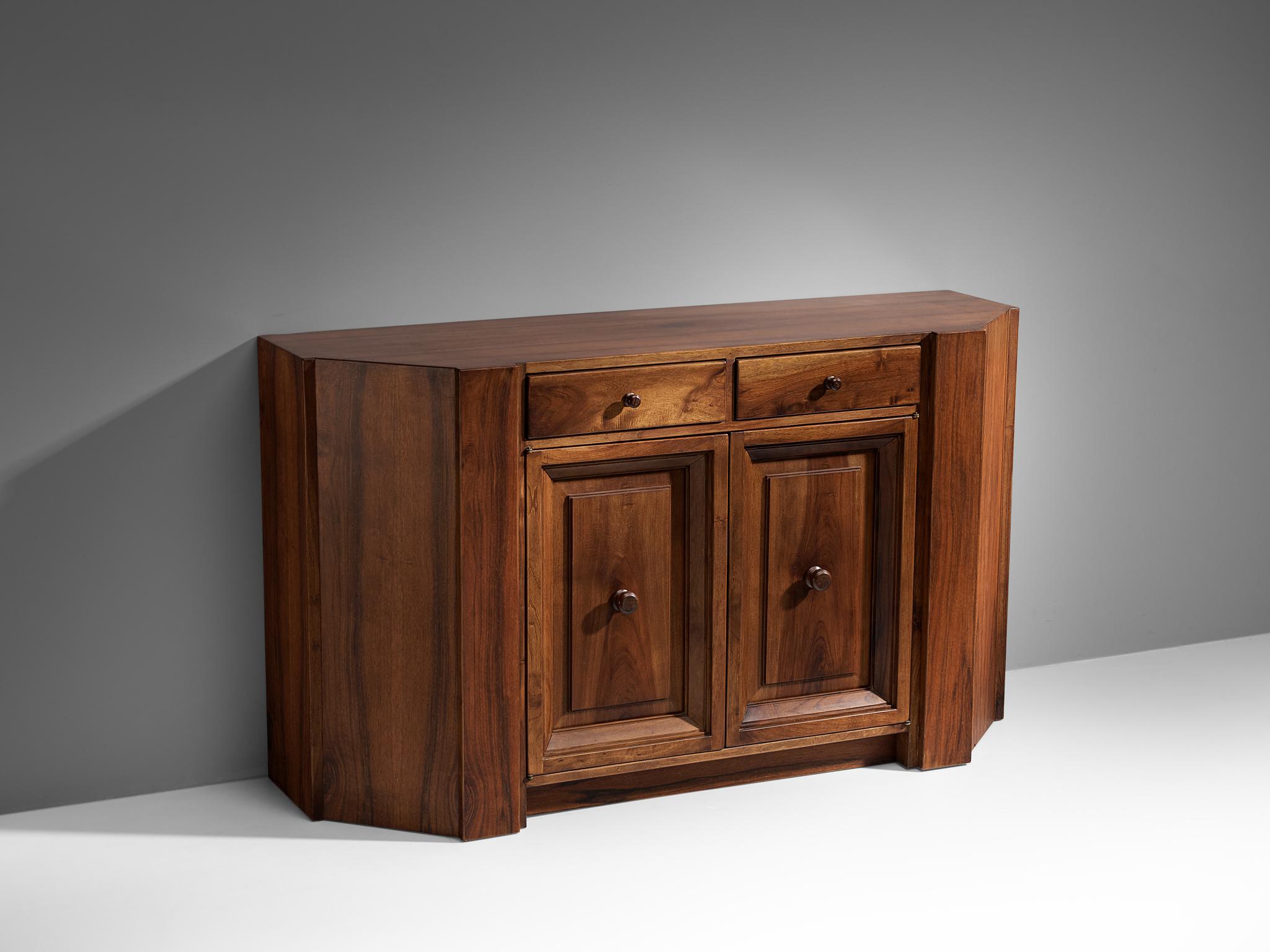 Giuseppe Rivadossi, cabinet, walnut, Italy, 1970s

This striking cabinet by Giuseppe Rivadossi pleases the eye by all means. The body of this piece is composed of large panels of walnut wood and small and elegant handles on both doors. Under the top