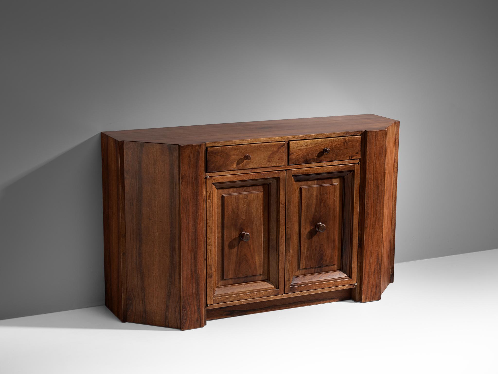 Giuseppe Rivadossi, cabinet, walnut, Italy, 1970s

This striking cabinet by Giuseppe Rivadossi pleases the eye by all means. The body of this piece is composed of large panels of walnut wood and small and elegant handles on both doors. Under the top