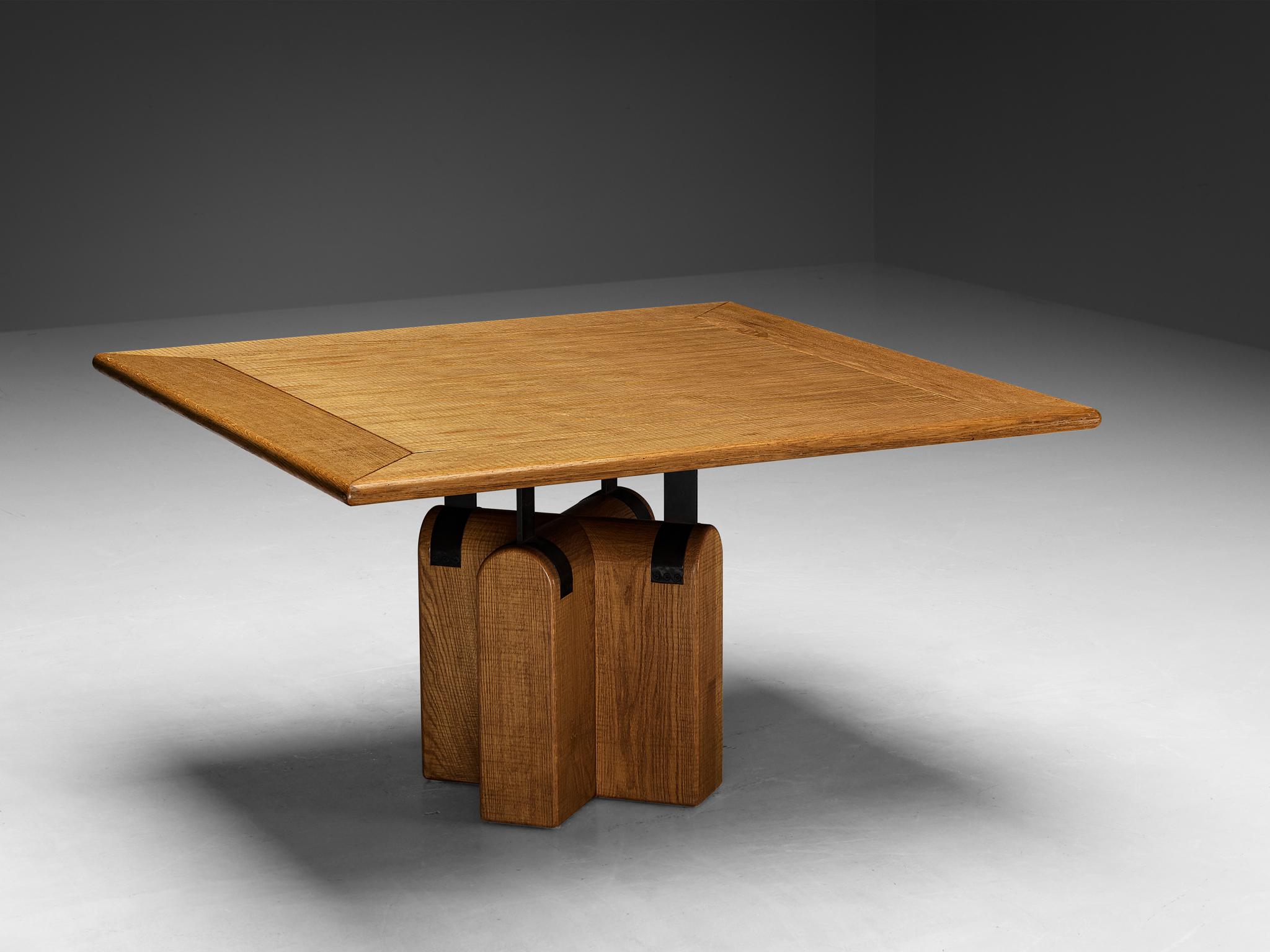 Giuseppe Rivadossi for Officina Rivadossi, dining table, oak, iron, Italy, 1970s

Once more, Giuseppe Rivadossi demonstrates his remarkable ability to embody material and technical expertise through this table, setting a prime example. The