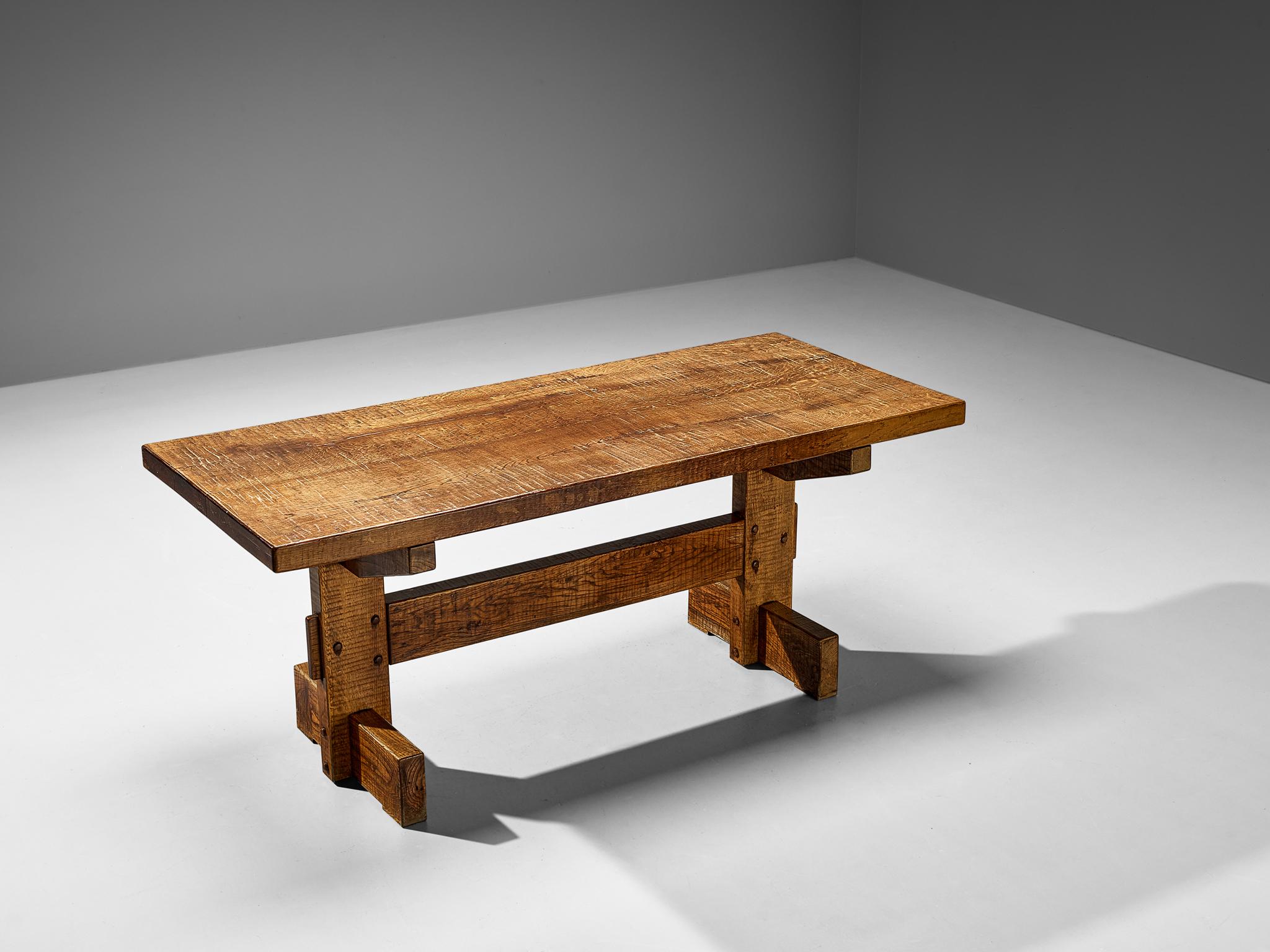 Giuseppe Rivadossi for Officina Rivadossi, dining table, oak, Italy, 1970s.

Giuseppe Rivadossi once again proves his great eye for materialization and technicality this table is exemplary for. The table is architecturally built based on the