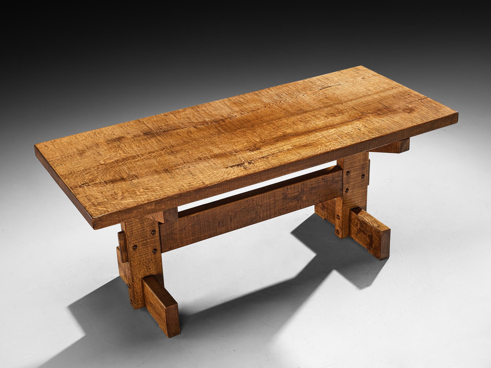 Giuseppe Rivadossi for Officina Rivadossi, dining table, oak, Italy, 1970s.

Giuseppe Rivadossi once again proves his great eye for materialization and technicality this table is exemplary for. The table is architecturally built based on the