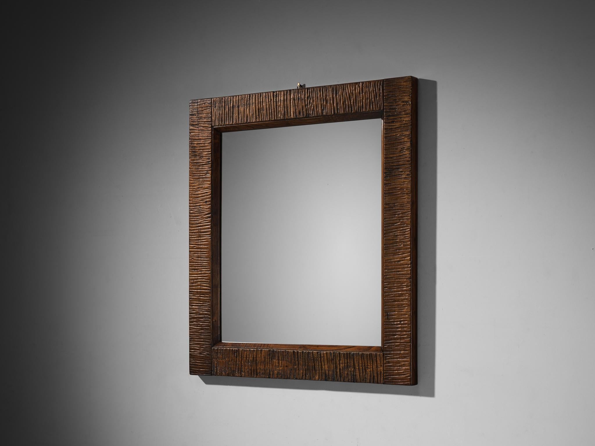 Giuseppe Rivadossi for Officina Rivadossi, wall-mounted mirror, walnut, Italy, 1970s

A rectangular mirror designed by Italian sculptor and artisan Giuseppe Rivadossi, showcasing fine craftsmanship. The walnut wood frame is expertly carved,